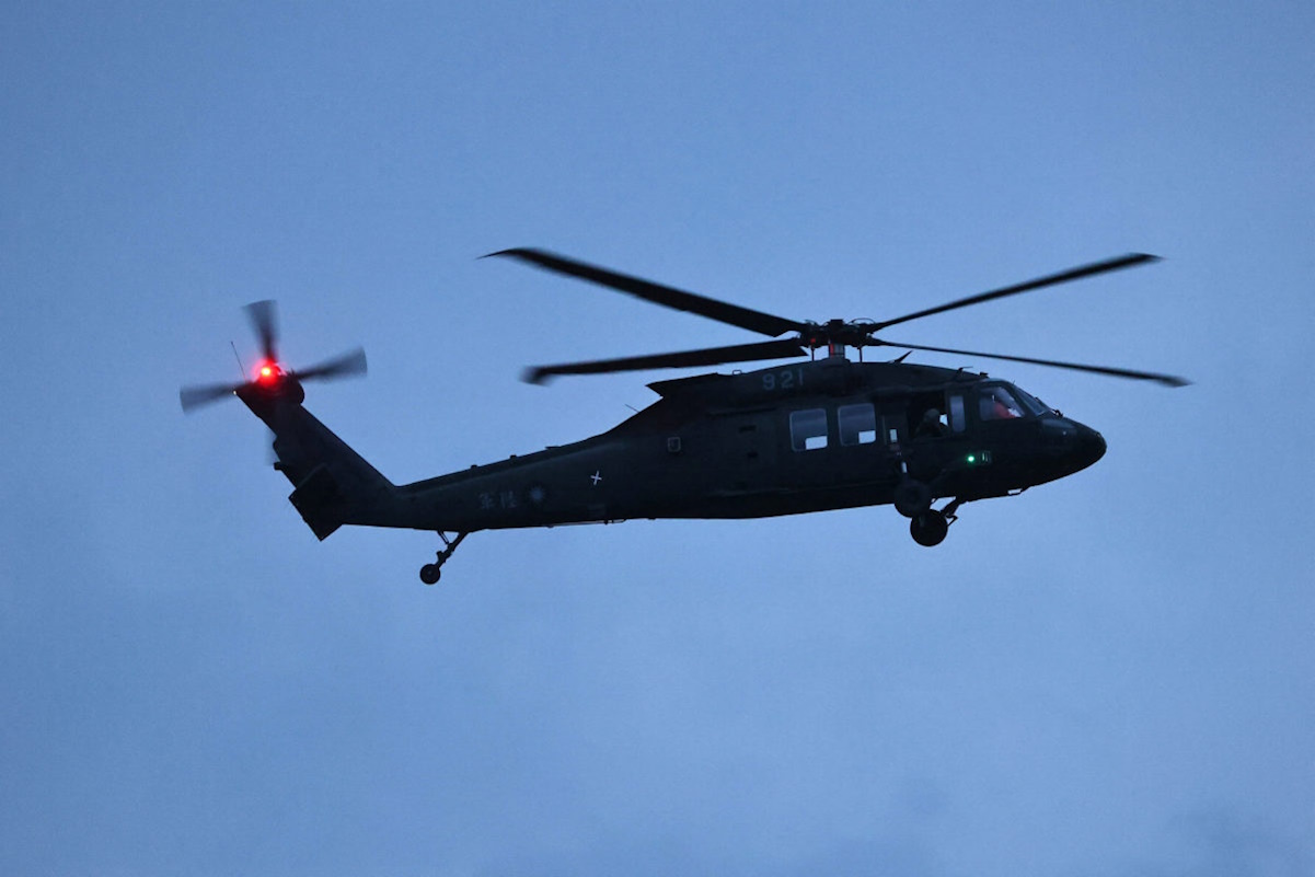 A UH-60 Black Hawk helicopter flies during a live-fire military exercise in Pingtung, Taiwan, September 6, 2022. REUTERS