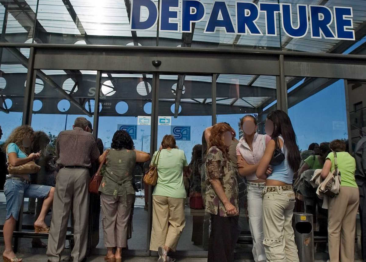 epa00815346 Passengers wait in front of the departure terminal at Sofia Airport, Bulgaria on Monday, 11September 2006. Bulgarian police temporarily evacuated Sofia International Airport on Monday after receiving a bomb threat but reopened terminals to passengers after no bomb was found, witnesses and officials said.  EPA