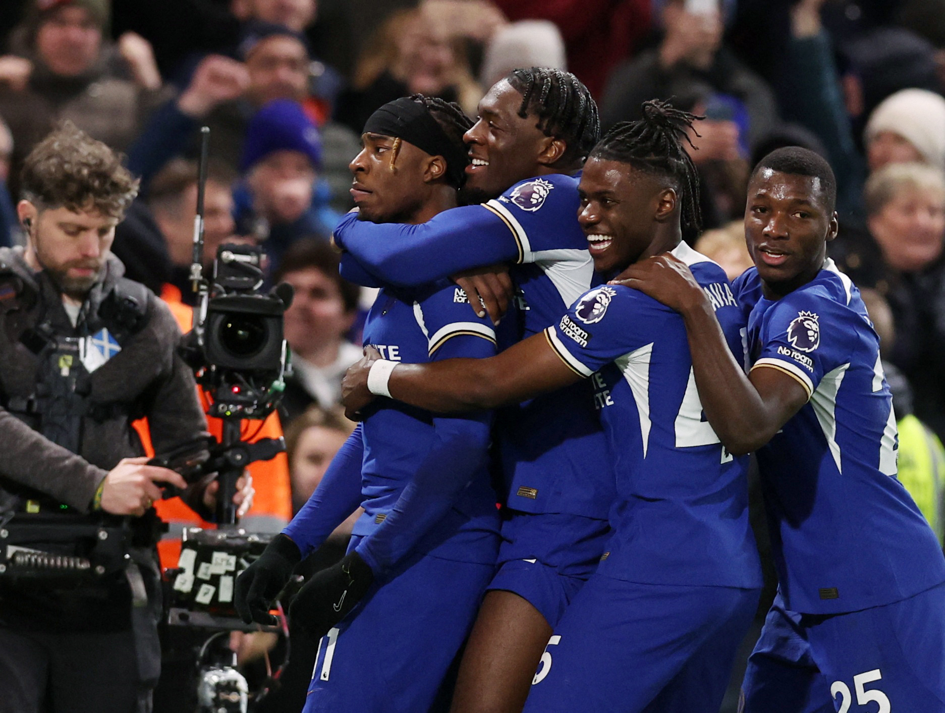 Soccer Football - Premier League - Chelsea v Crystal Palace - Stamford Bridge, London, Britain - December 27, 2023 Chelsea's Noni Madueke celebrates scoring their second goal with teammates REUTERS