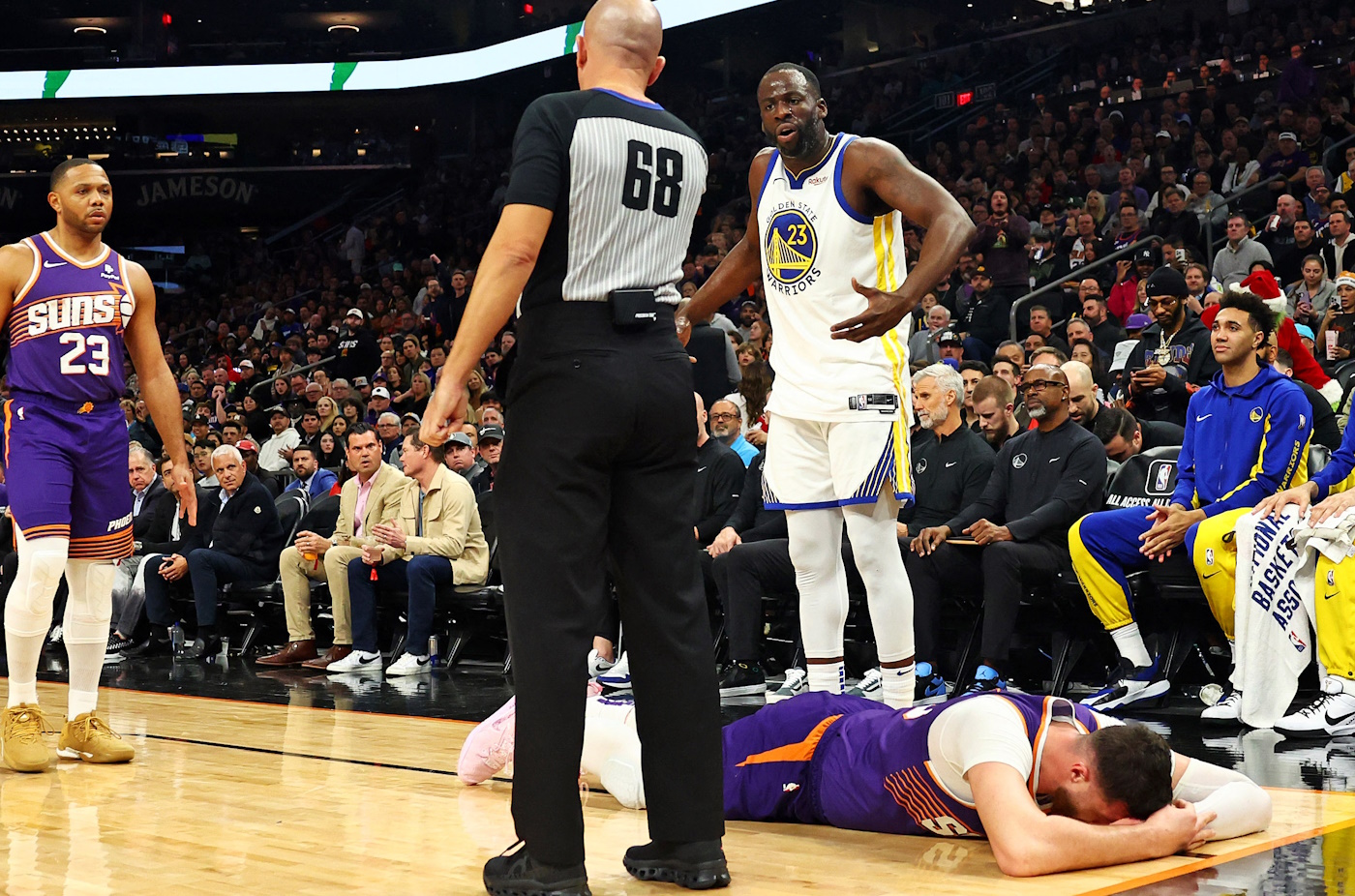 Dec 12, 2023; Phoenix, Arizona, USA; Golden State Warriors forward Draymond Green (23) reacts after being called for a foul on Phoenix Suns center Jusuf Nurkic (20) during the third quarter at Footprint Center. Mandatory Credit: Mark J. Rebilas-USA TODAY Sports