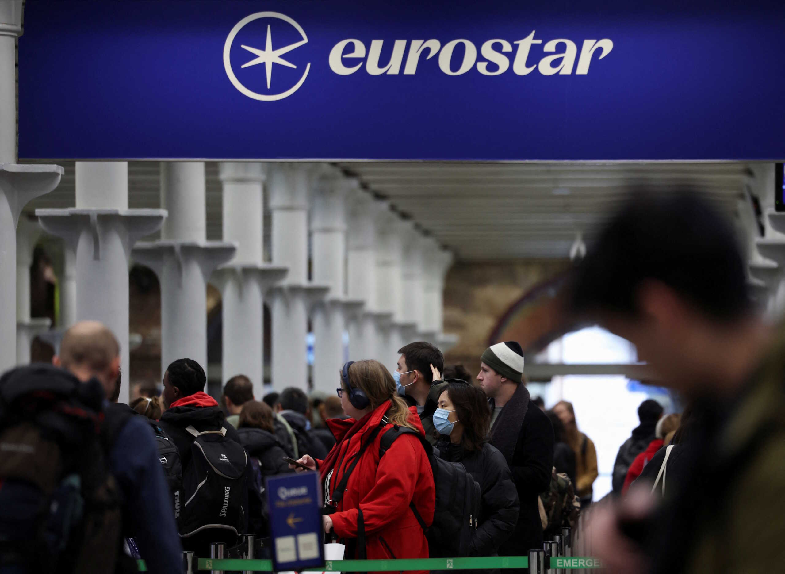 Passengers queue at the departure gates of the Eurostar terminal at St Pancras International Station, as services resume following Thursday's strike at the Eurotunnel, in London, Britain, December 22, 2023. REUTERS