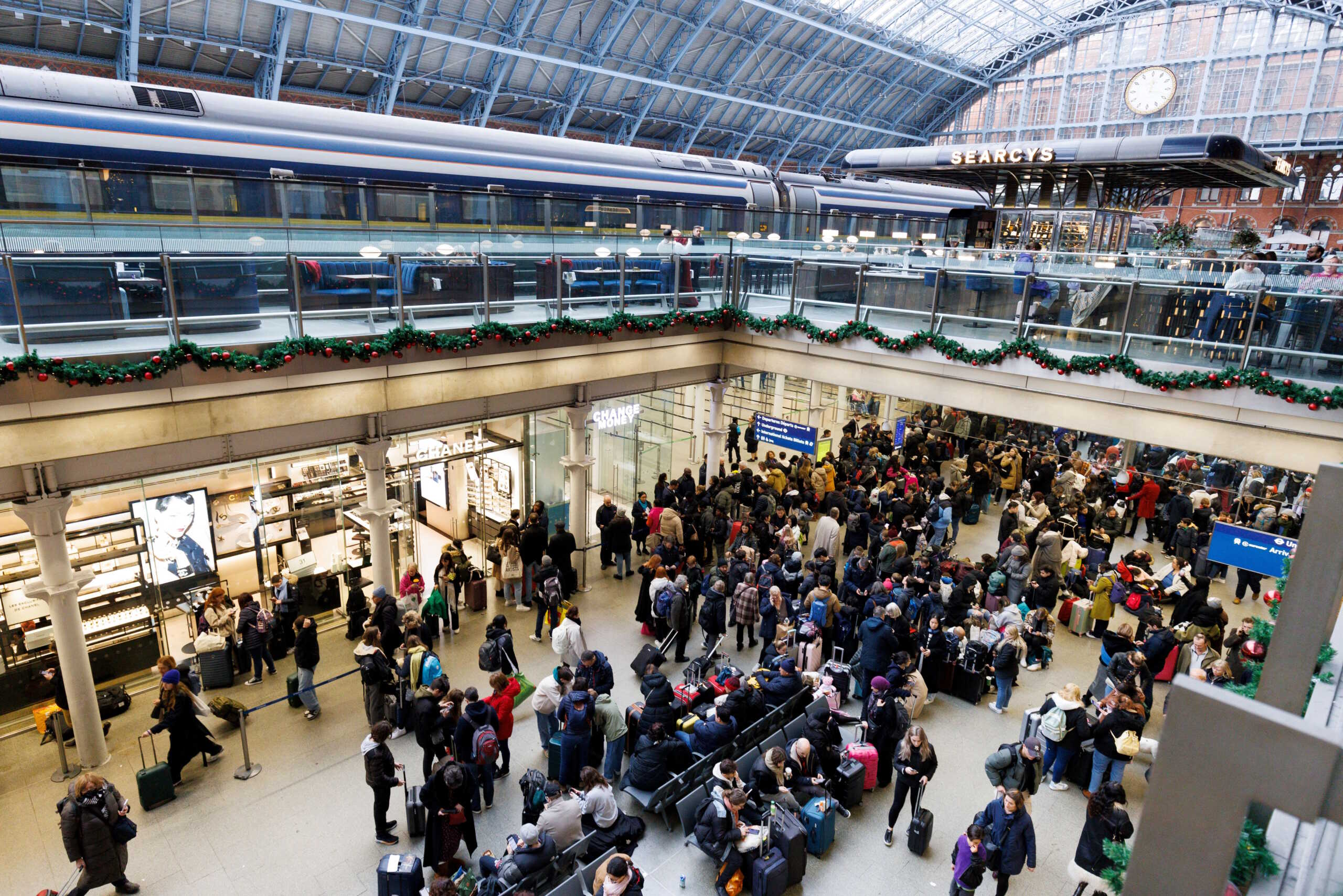 Passengers gather at the departure gates of the Eurostar terminal at St Pancras International Station after the services are cancelled due to a flooded tunnel, in London, Britain, December 30, 2023. REUTERS