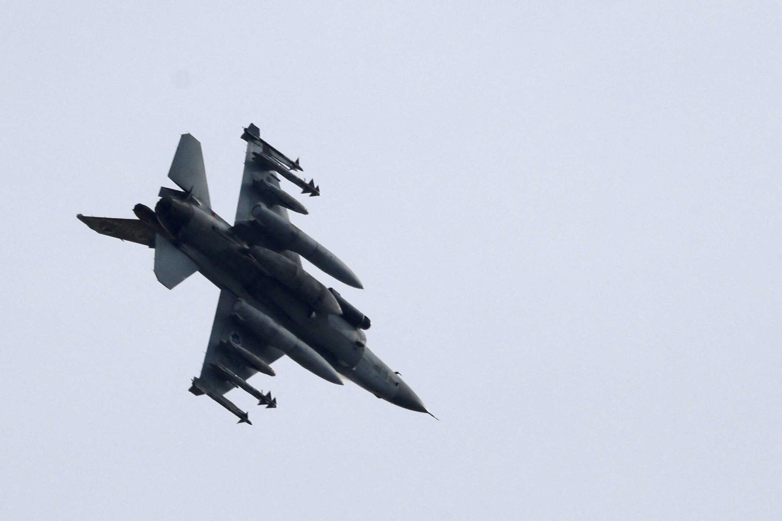An Israeli Air Force F-16 fighter jet flies near the Israeli border with Gaza amid the ongoing conflict between Israel and the Palestinian Islamist group Hamas, as seen from Ashkelon, Israel, December 10, 2023  REUTERS