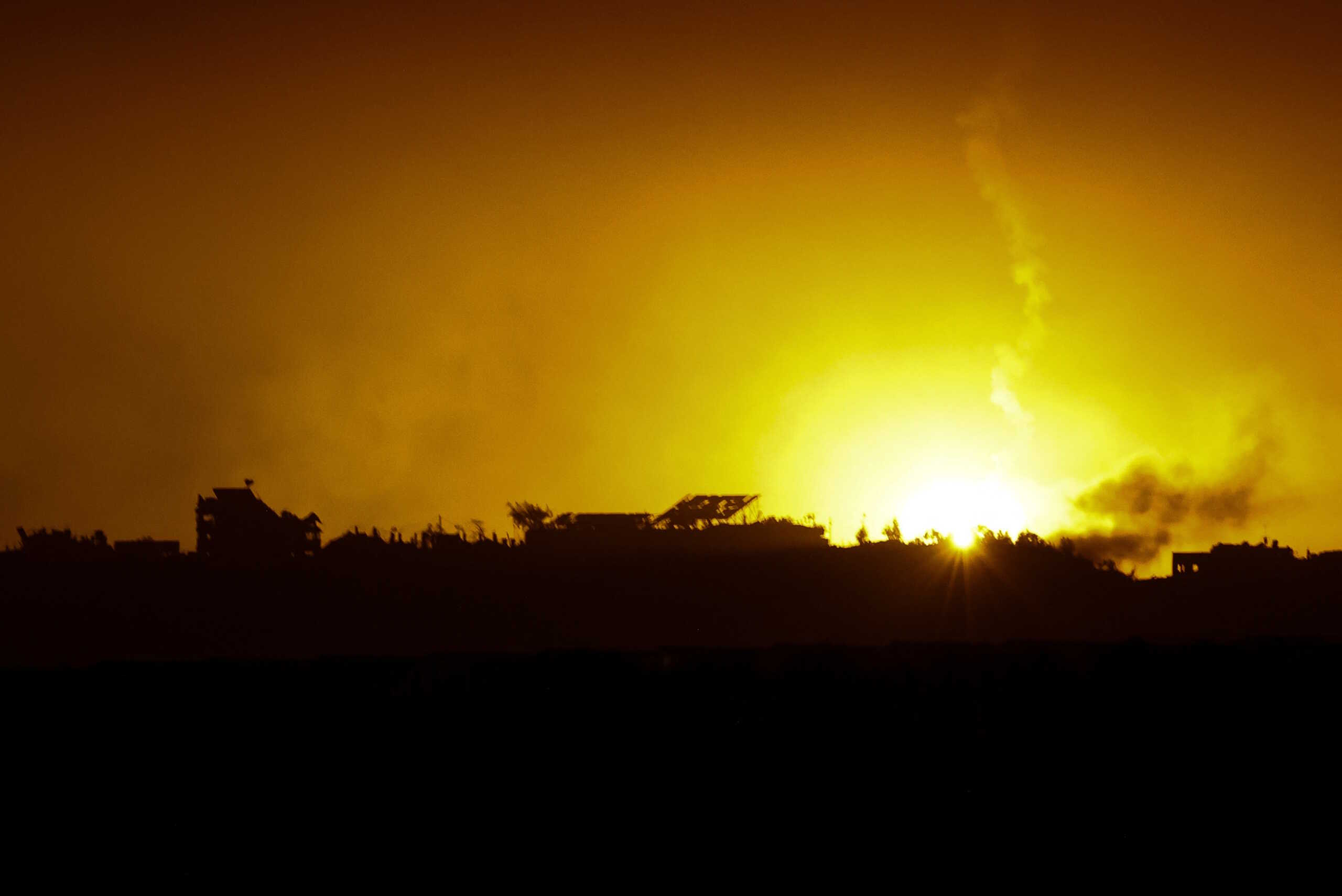 A flare falls over Gaza, amid the ongoing conflict between Israel and the Palestinian Islamist group Hamas, as seen from southern Israel, December 7, 2023. REUTERS