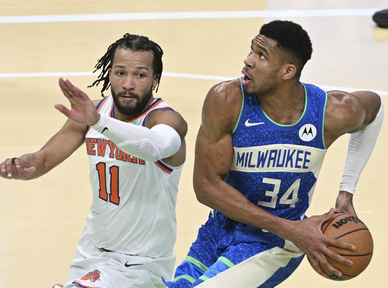 Dec 5, 2023; Milwaukee, Wisconsin, USA; Milwaukee Bucks forward Giannis Antetokounmpo (34) drives to the basket against New York Knicks guard Jalen Brunson (11) in the second half at Fiserv Forum. Mandatory Credit: Michael McLoone-USA TODAY Sports