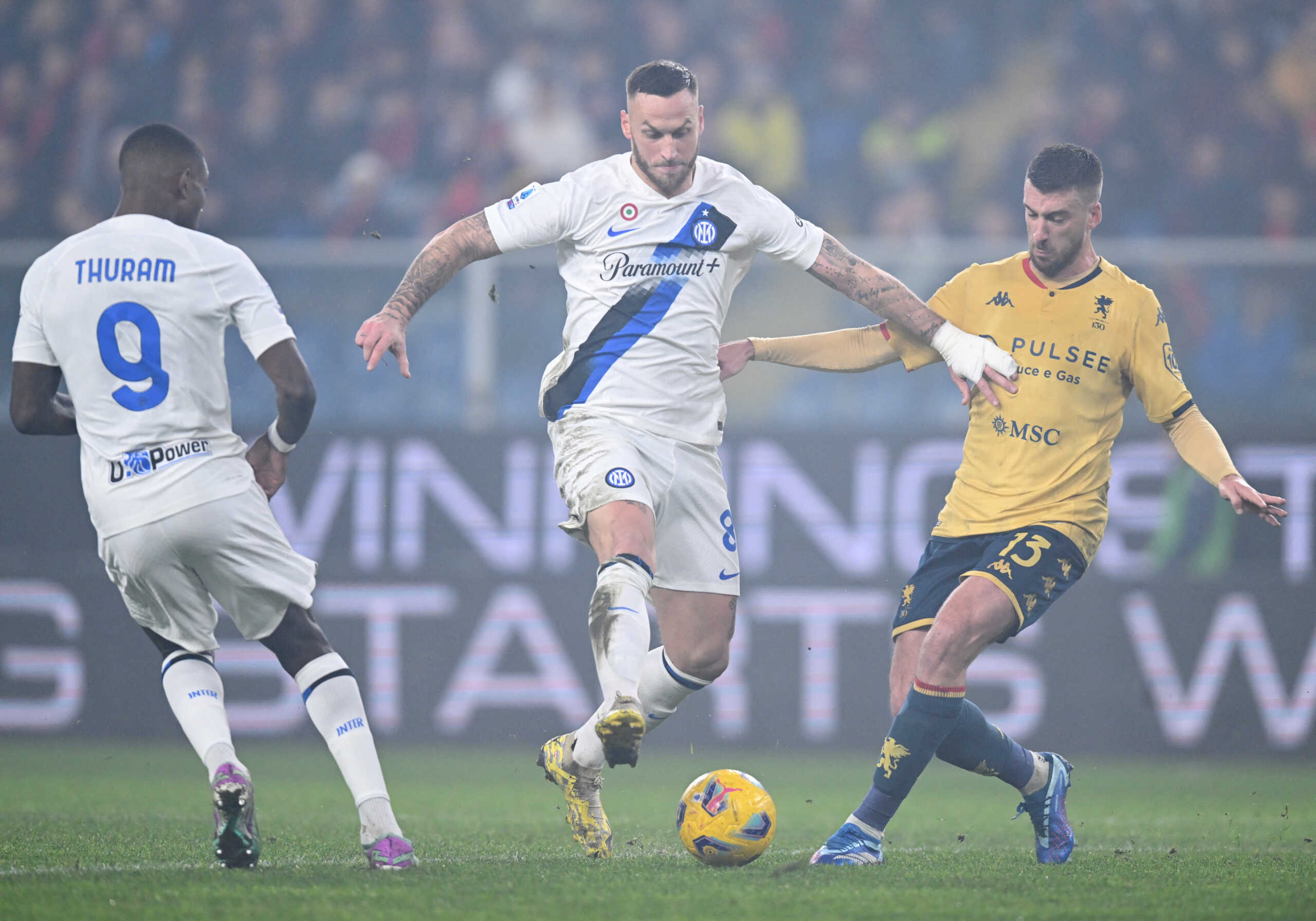 Soccer Football - Serie A - Genoa v Inter Milan - Stadio Comunale Luigi Ferraris, Genoa, Italy - December 29, 2023 Inter Milan's Marcus Thuram and Marko Arnautovic in action with Genoa's Mattia Bani REUTERS