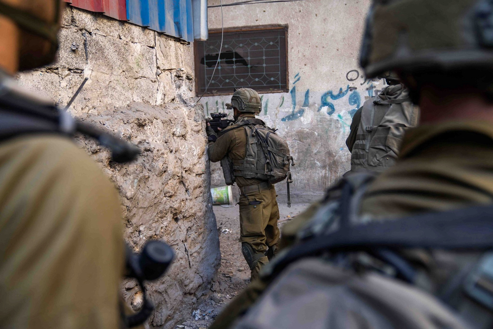 Israeli soldiers operate in the Gaza Strip amid the ongoing conflict between Israel and the Palestinian Islamist group Hamas, in this handout picture released on December 29, 2023. Israel Defense Forces