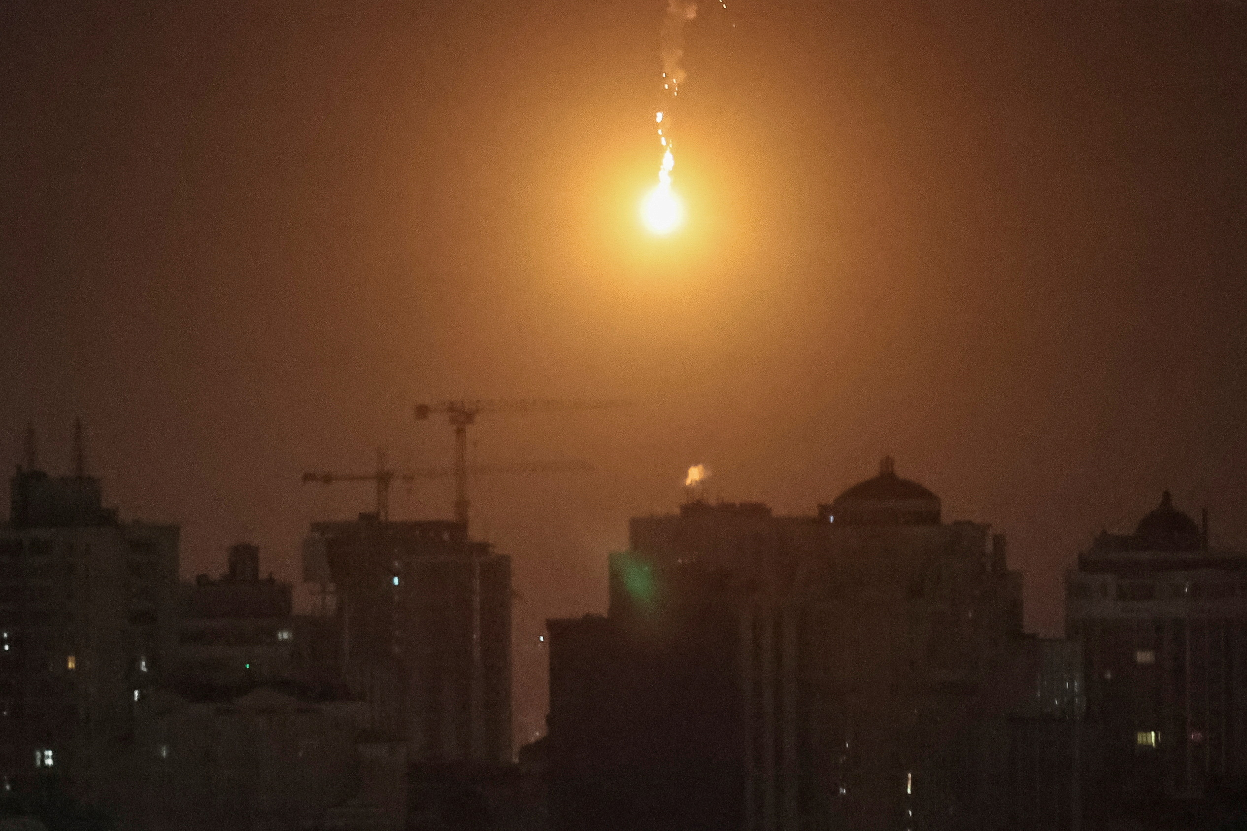 An explosion of a drone is seen in the sky over the city during a Russian drone strike, amid Russia's attack on Ukraine, in Kyiv, Ukraine November 25, 2023. REUTERS