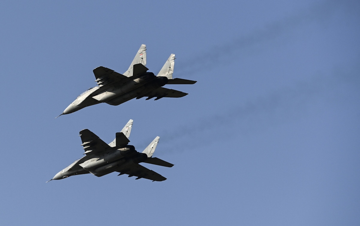 epa10864250 MIG-29 aircraft of the Serbian Air Force perform during the air show at the Stenkovec airport near Skopje, North Macedonia, 16 September 2023. More than 50 different aircraft participate in the air meeting to mark 100 years of Macedonian civil aviation.  EPA