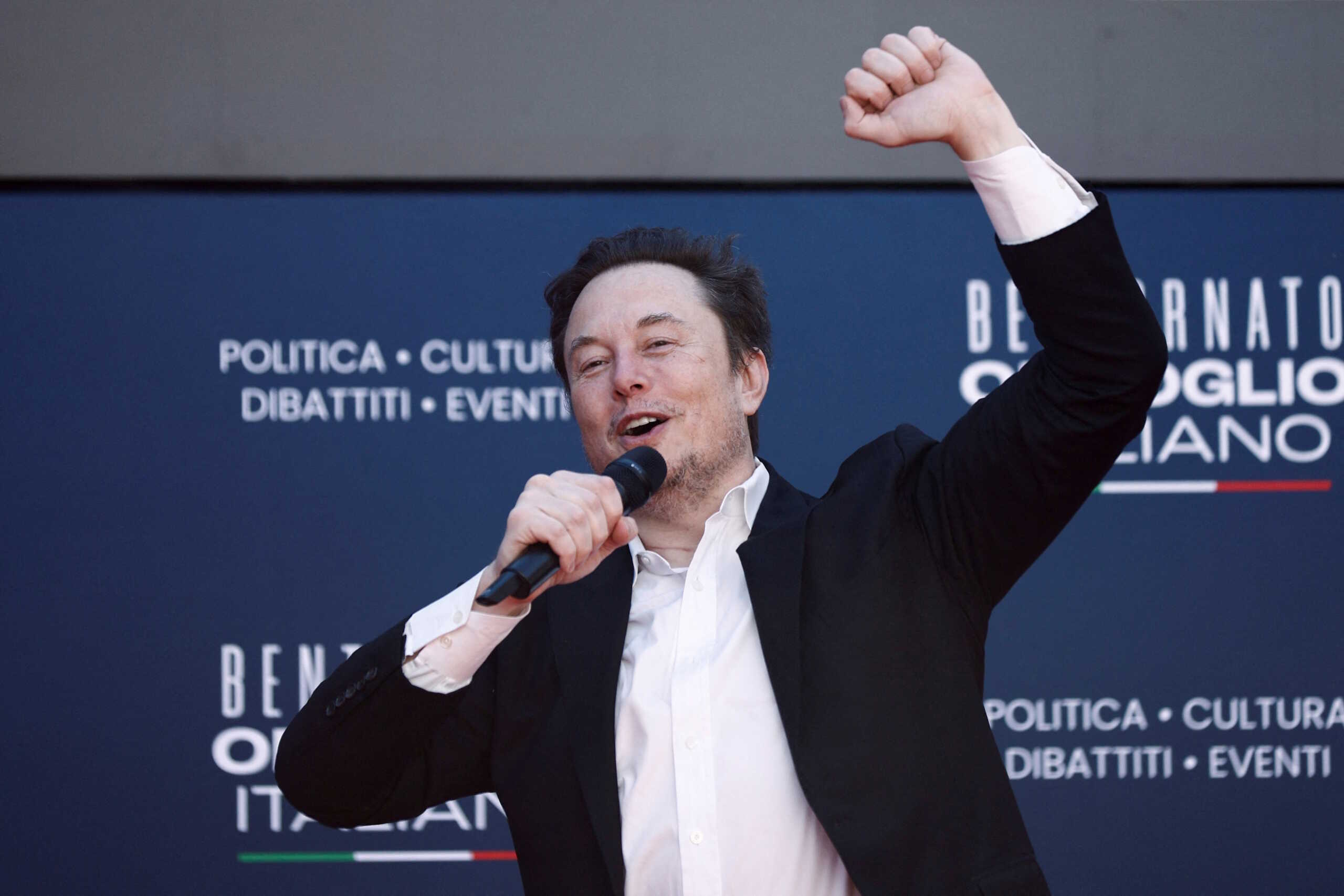 Tesla and SpaceX's CEO Elon Musk gestures, as he attends political festival Atreju organised by Italian Prime Minister Giorgia Meloni's Brothers of Italy (Fratelli d'Italia) right-wing party, in Rome, Italy, December 16, 2023. REUTERS