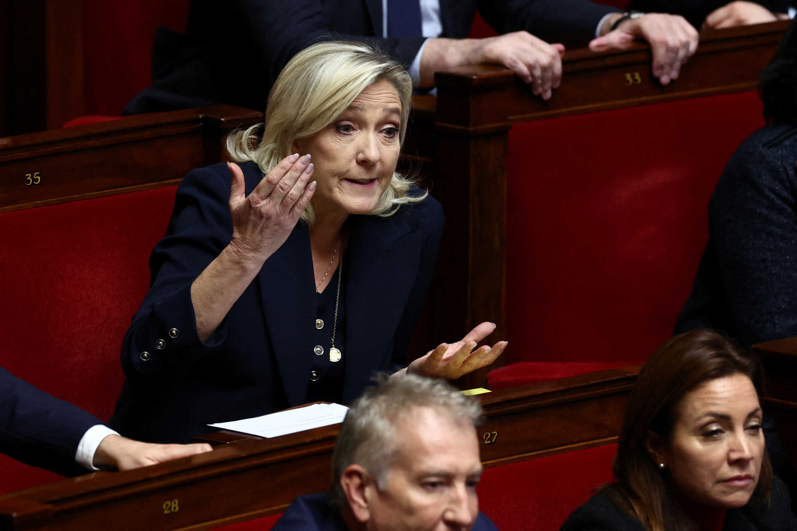 Marine Le Pen, member of parliament and president of the French far-right National Rally (Rassemblement National - RN) party parliamentary group, reacts during the questions to the government session at the National Assembly in Paris, France, December 5, 2023. REUTERS