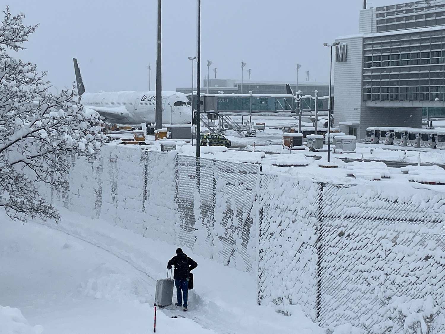 Passengers stand in line at Munich's airport after heavy snowfall hit Bavaria and its capital Munich, Germany, December 2, 2023. The German Bundesliga soccer match FC Bayern Munich v 1. FC Union Berlin had to be cancelled, trains halted and the airport closed because of the the weather condition.     REUTERS