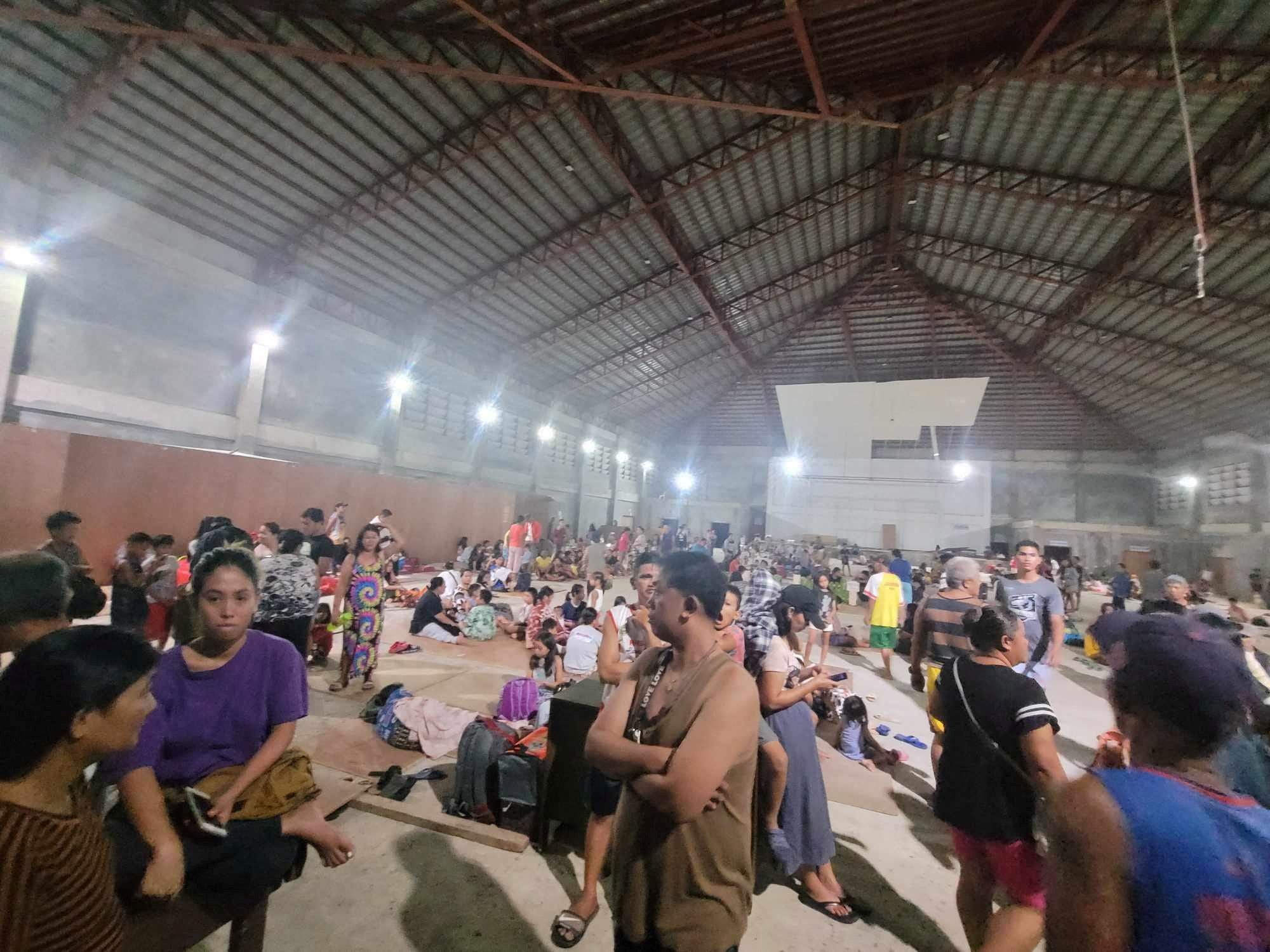 People gather at an evacuation center, in the aftermath of an earthquake, in Hinatuan, Surigao del Sur, Philippines December 2, 2023. Hinatuan LGU