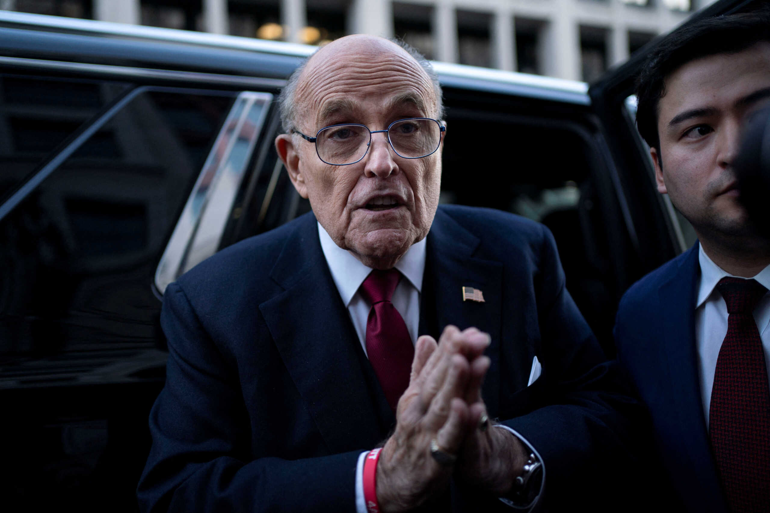 Former New York Mayor Rudy Giuliani departs the U.S. District Courthouse after he was ordered to pay $148 million in his defamation case in Washington, U.S., December 15, 2023. REUTERS