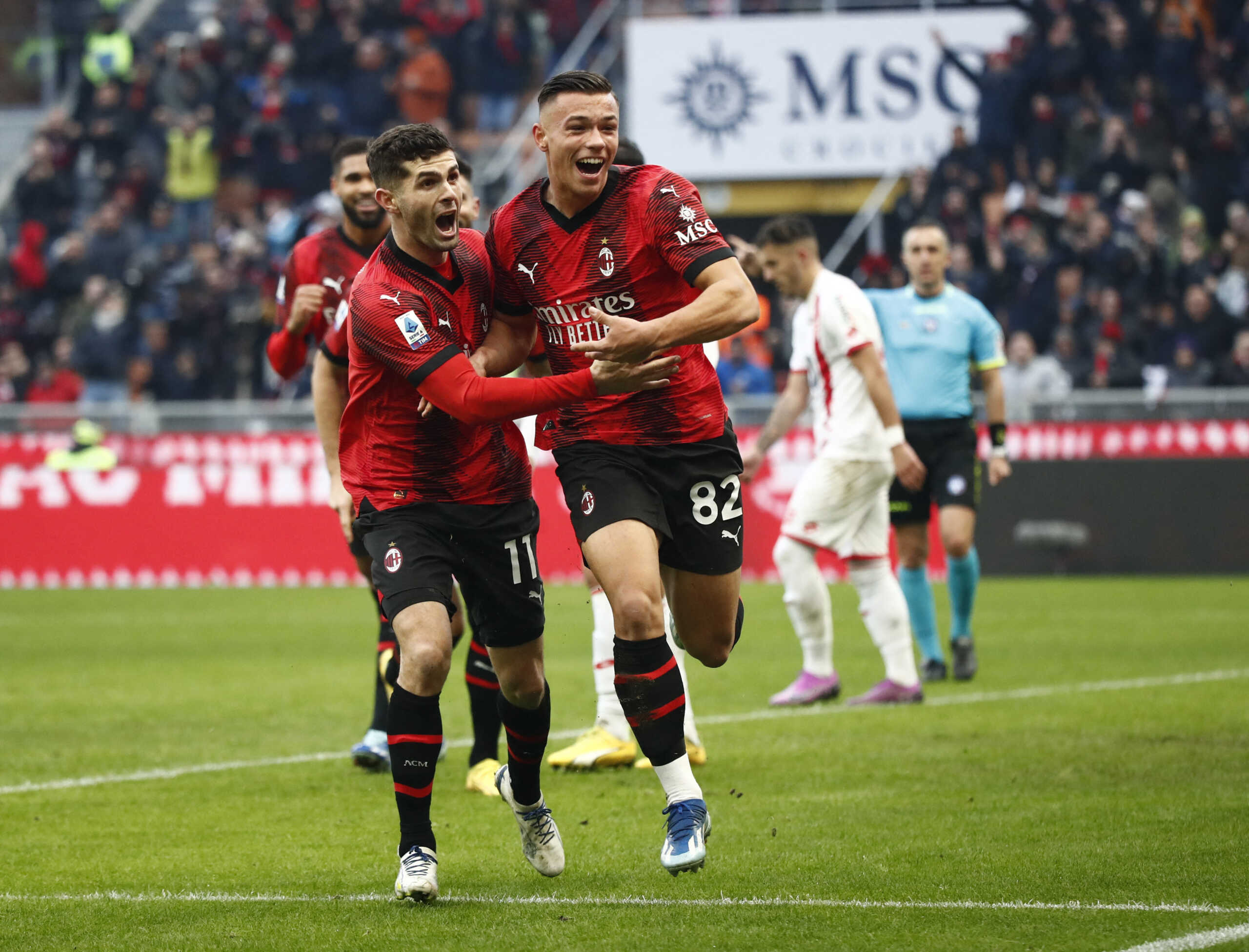 Soccer Football - Serie A - AC Milan v Monza - San Siro, Milan, Italy - December 17, 2023 AC Milan's Jan-Carlo Simic celebrates scoring their second goal with Christian Pulisic REUTERS