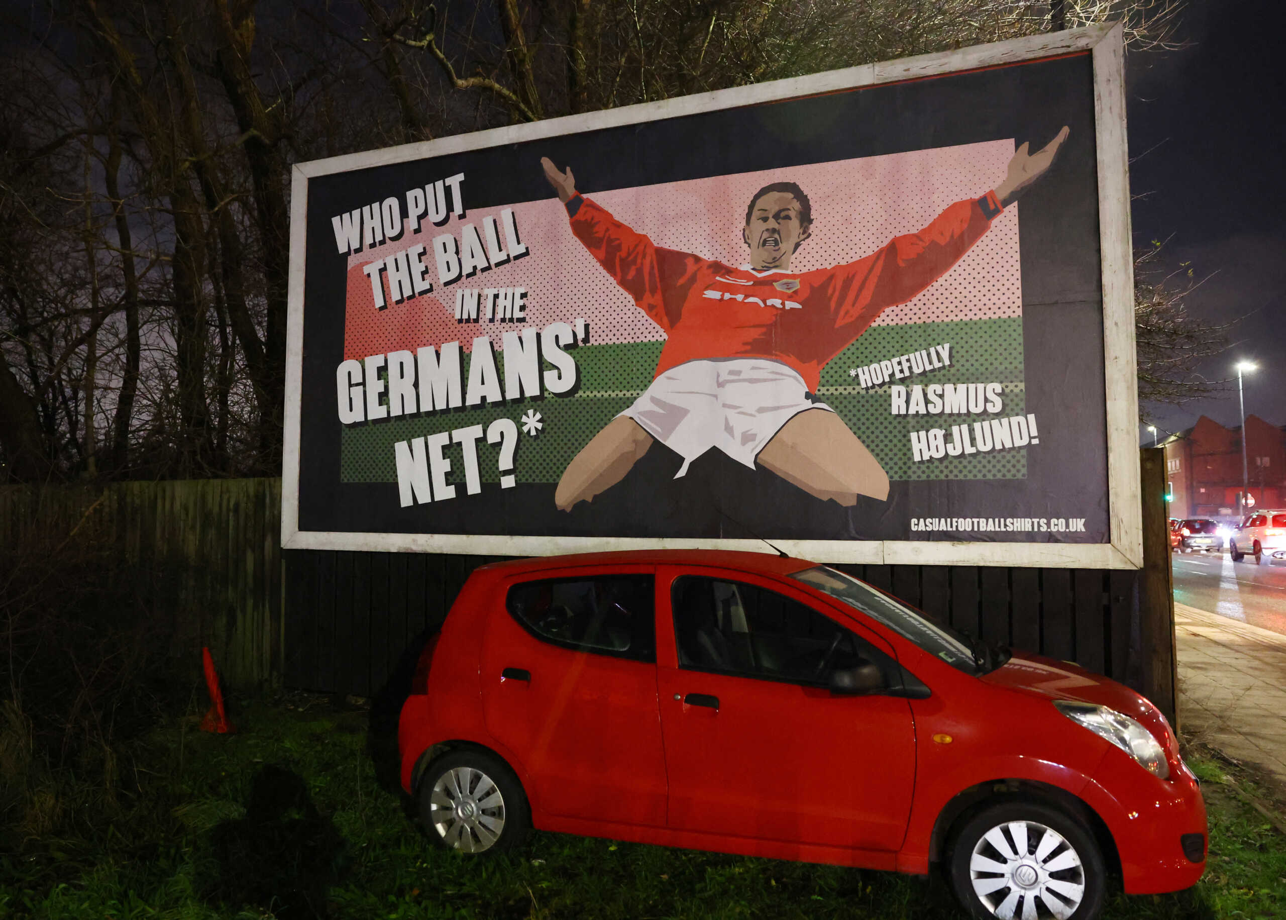 Soccer Football - Champions League - Group A - Manchester United v Bayern Munich - Old Trafford, Manchester, Britain - December 12, 2023 A billboard illustration of former Manchester United's Ole Gunnar Solskjaer is displayed outside the stadium before the match REUTERS