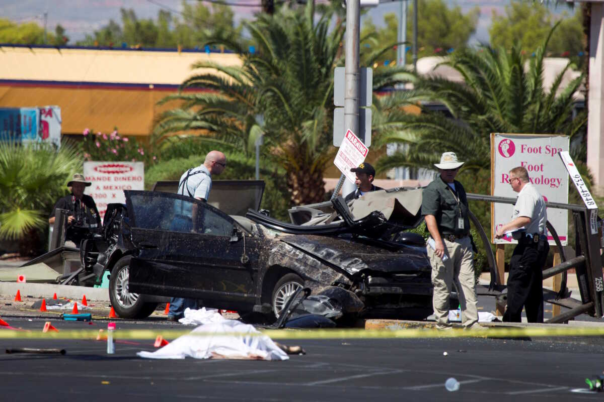FILE PHOTO: Las Vegas Metropolitan Police investigate an accident scene after a car crashed into a bus stop, killing four people and injuring eight, in Las Vegas, Nevada September 13, 2012. Police said they suspect the driver was drunk and speeding. REUTERS