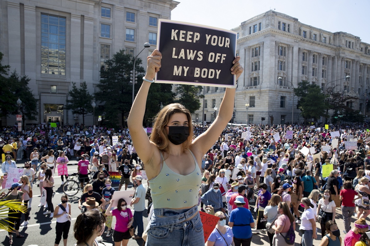 epa09502528 Thousands of people participate in the Women's March in Washington, DC, USA, 02 October 2021. Thousands in Washington and other parts of the United States participated in rallies to voice support for the lanmark Supreme Court case on abortion, Roe vs Wade. Participants also gathered to voice opposition to a Texas law limiting abortion to within the first six weeks of pregnancy.  EPA