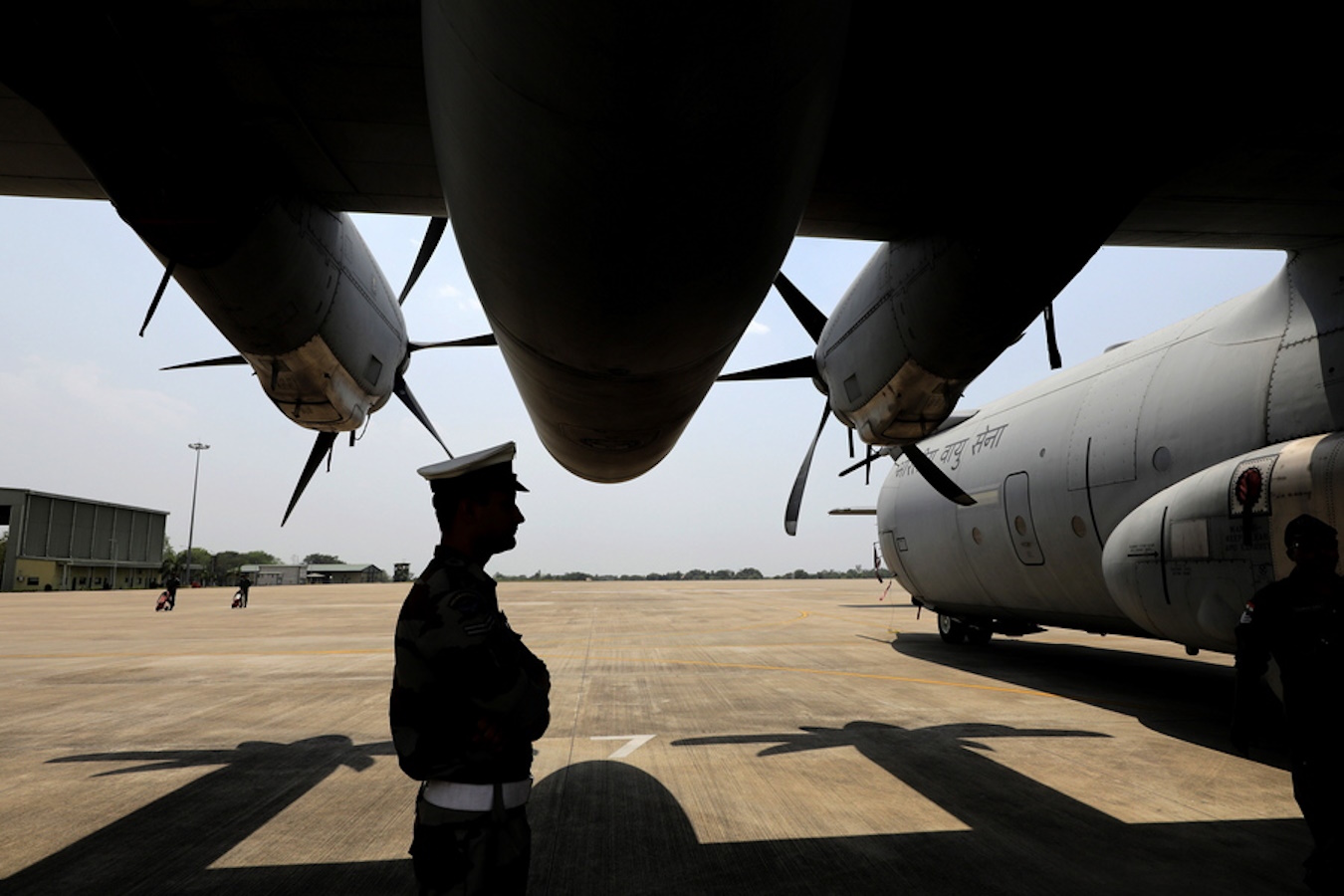 epa10581458 An Indian Airforce officer stands with the fighter planes during the joint India-US military exercise 'Cope India 2023' at Panagarh Air Base, far west of Kolkata, 20 April 2023. 'Cope India 2023' is a bilateral Air exercise between the Indian and US Air Forces and takes place between 10 to 23 April 2023.  EPA