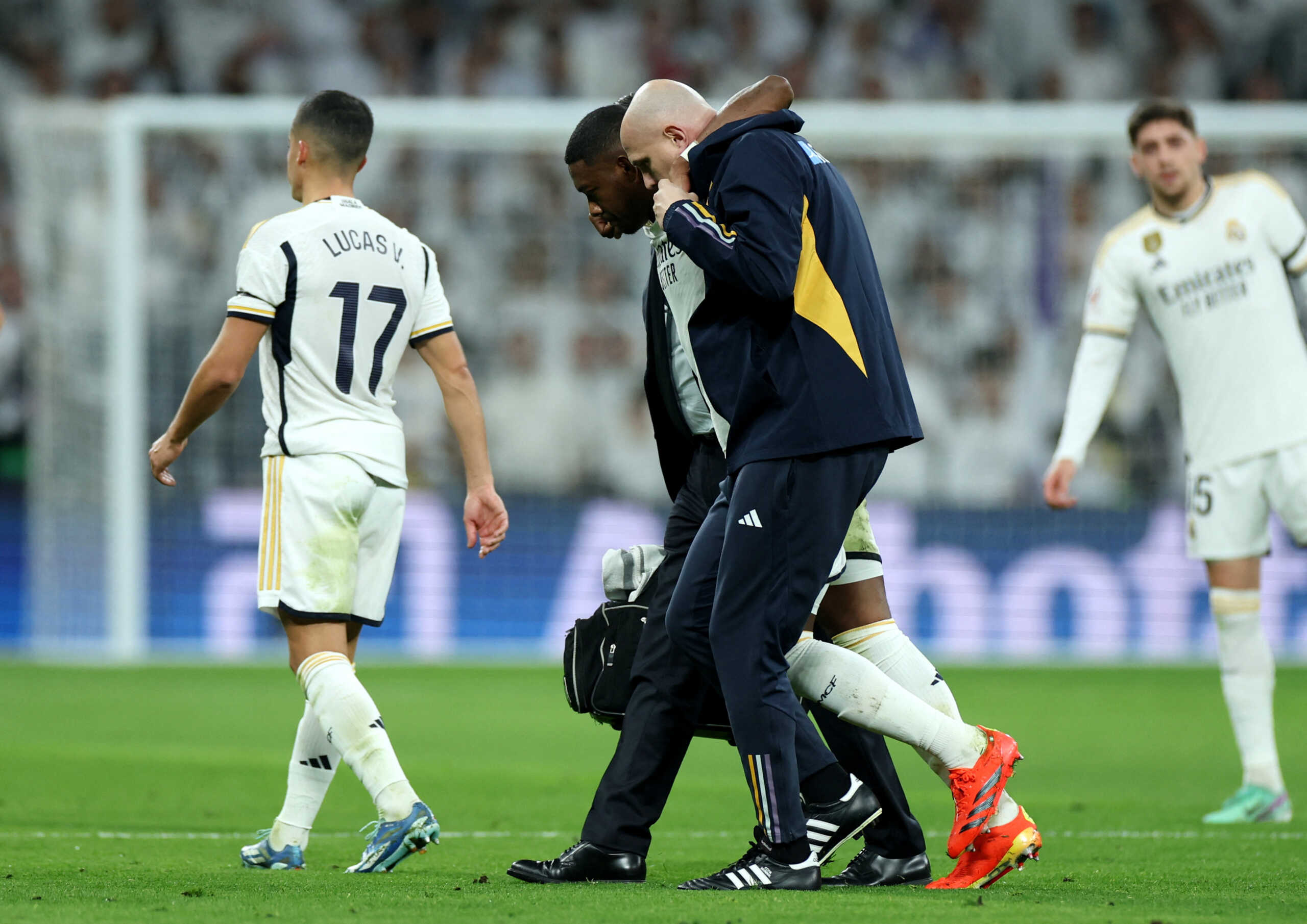Soccer Football - LaLiga - Real Madrid v Villarreal - Santiago Bernabeu, Madrid, Spain - December 17, 2023 Real Madrid's David Alaba receives medical attention after sustaining an injury REUTERS