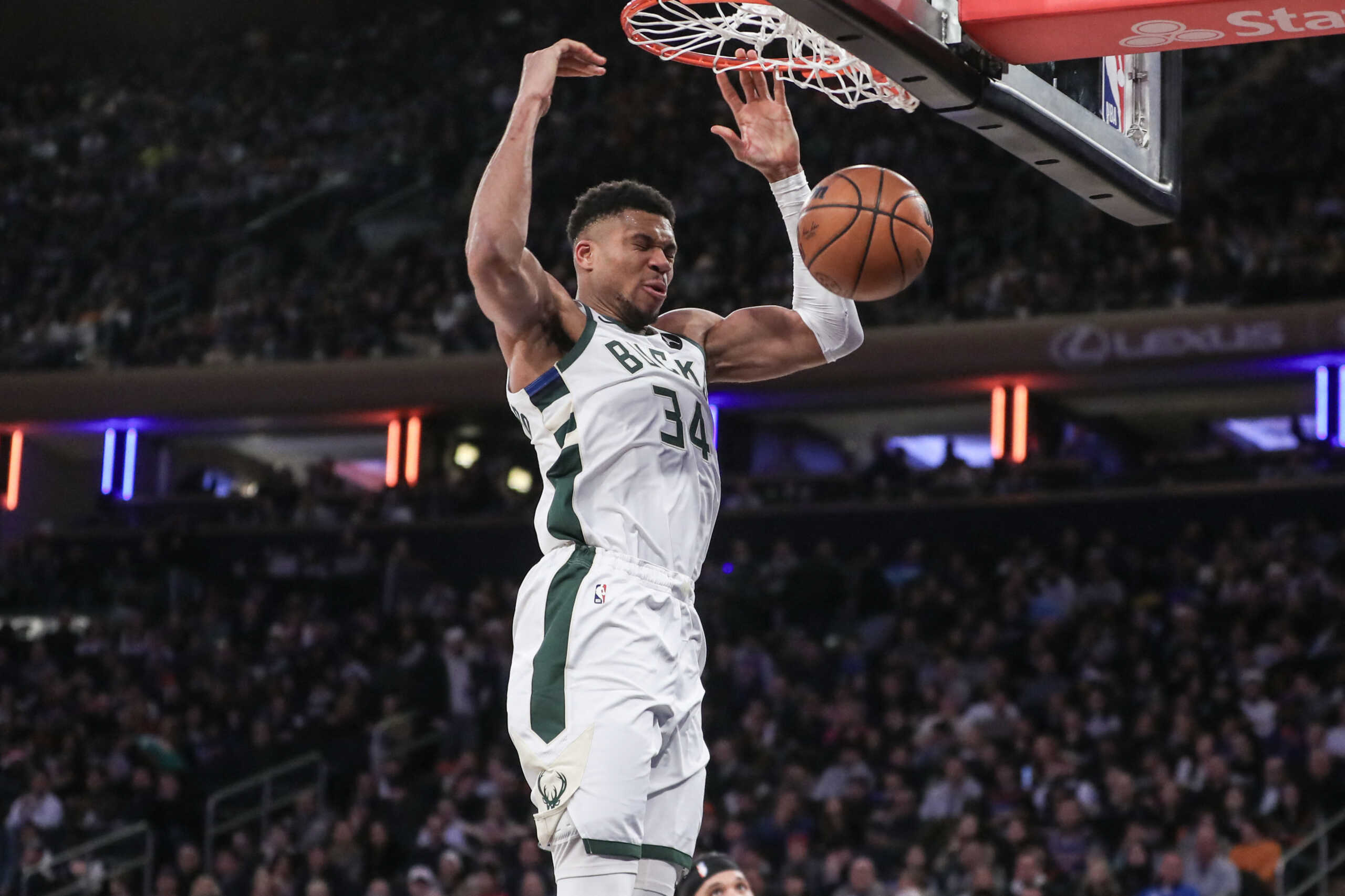 Dec 23, 2023; New York, New York, USA;  Milwaukee Bucks forward Giannis Antetokounmpo (34) dunks in the fourth quarter against the New York Knicks at Madison Square Garden. Mandatory Credit: Wendell Cruz-USA TODAY Sports