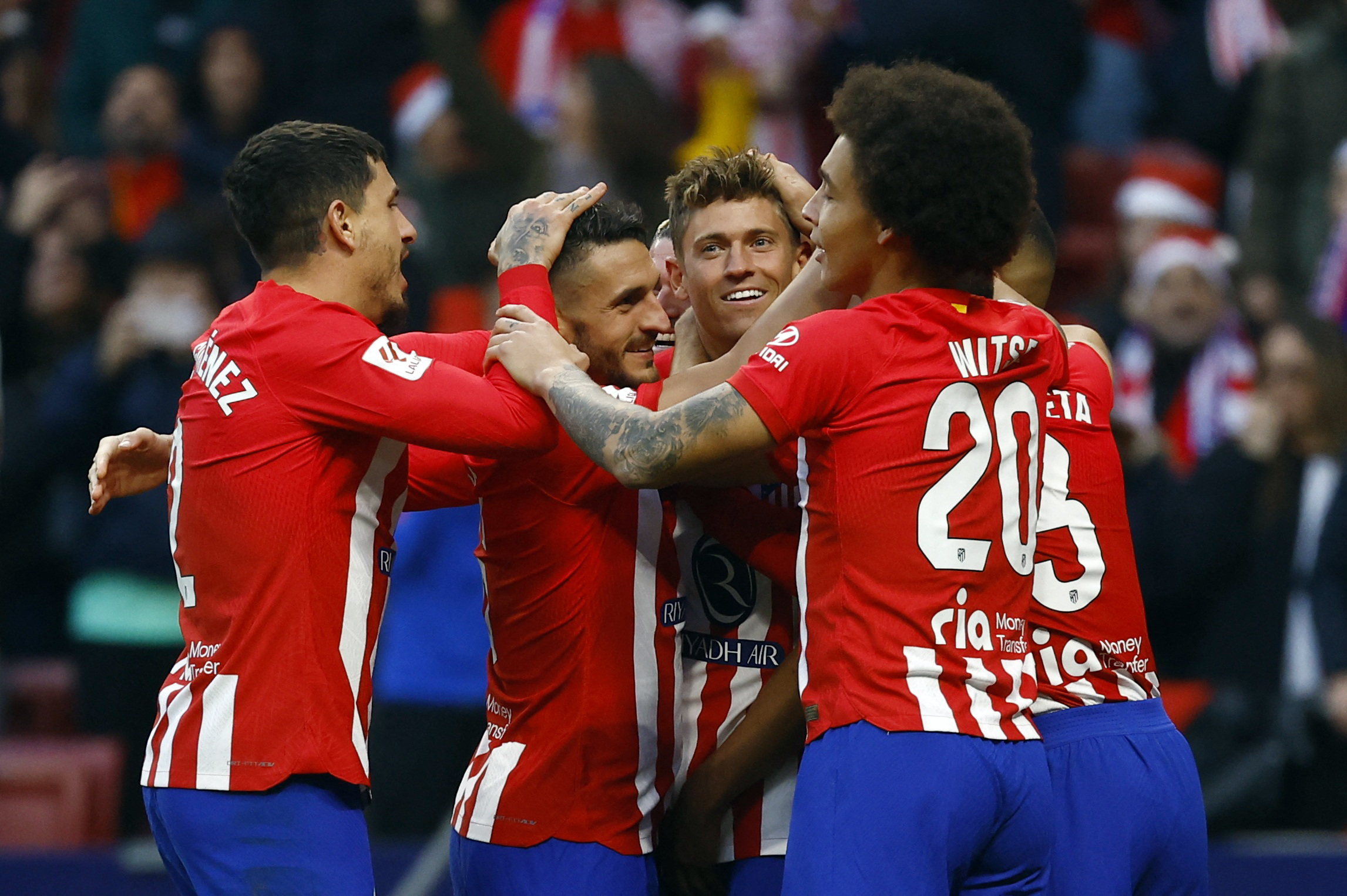 Soccer Football - LaLiga - Atletico Madrid v Sevilla - Metropolitano, Madrid, Spain - December 23, 2023 Atletico Madrid's Marcos Llorente celebrates scoring their first goal with teammates REUTERS