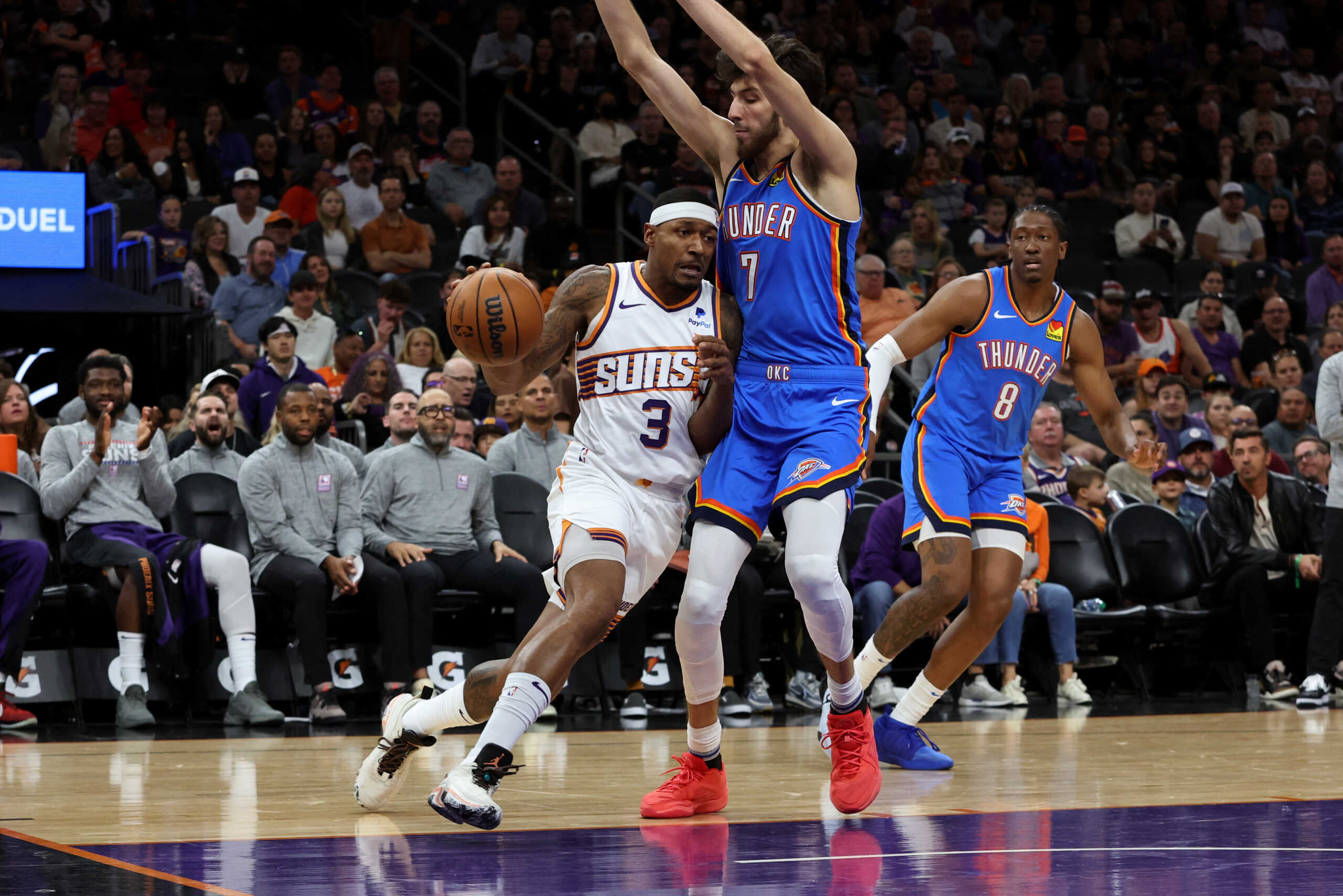 Nov 12, 2023; Phoenix, Arizona, USA; Phoenix Suns guard Bradley Beal (3) drives to the net against Oklahoma City Thunder forward Chet Holmgren (7) during the first quarter at Footprint Center. Mandatory Credit: Zachary BonDurant-USA TODAY Sports