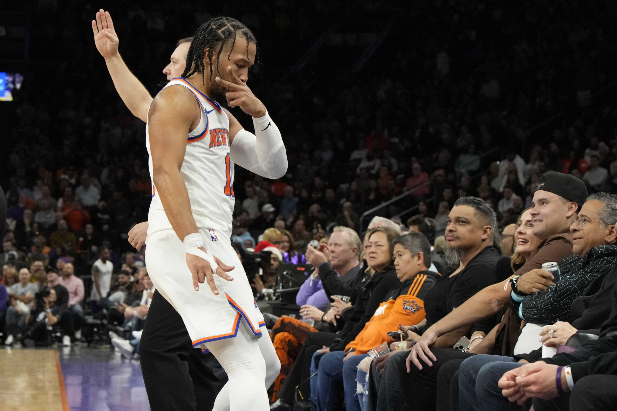 Dec 15, 2023; Phoenix, Arizona, USA; New York Knicks guard Jalen Brunson (11) rects after scoring against the Phoenix Suns in the second half at Footprint Center. Mandatory Credit: Rick Scuteri-USA TODAY Sports