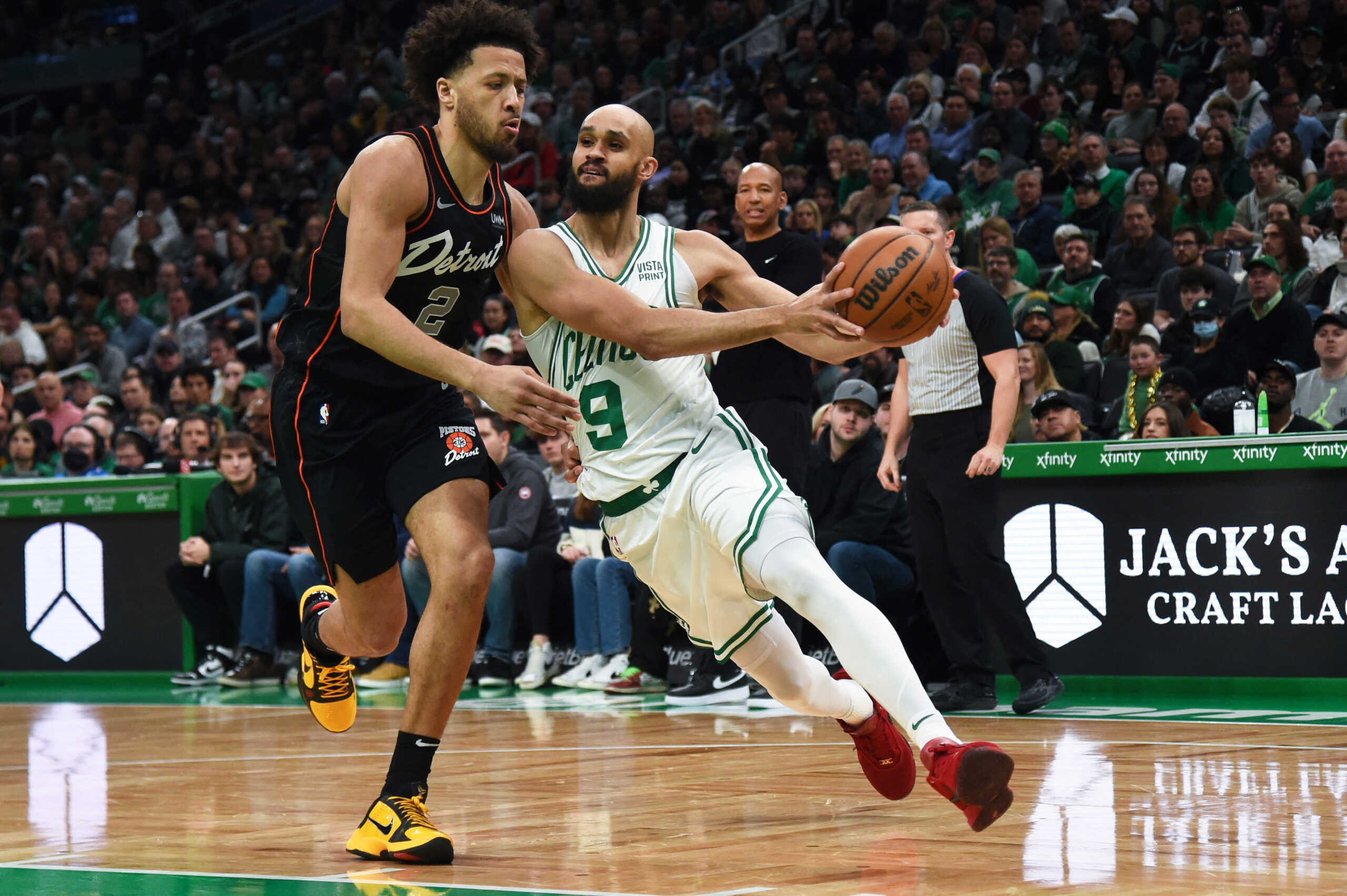 Dec 28, 2023; Boston, Massachusetts, USA;  Boston Celtics guard Derrick White (9) controls the ball while Detroit Pistons guard Cade Cunningham (2) defends during the first half at TD Garden. Mandatory Credit: Bob DeChiara-USA TODAY Sports