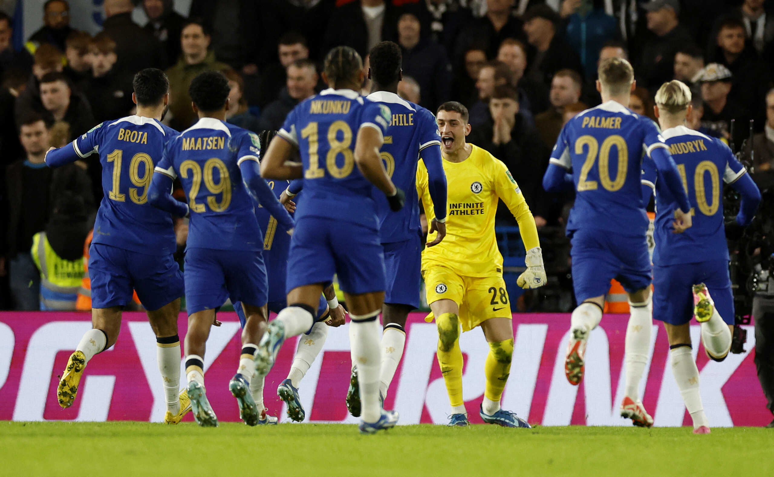 Soccer Football - Carabao Cup - Quarter Final - Chelsea v Newcastle United - Stamford Bridge, London, Britain - December 19, 2023 Chelsea's Djordje Petrovic celebrates with teammates after winning the penalty shootout Action Images via Reuters