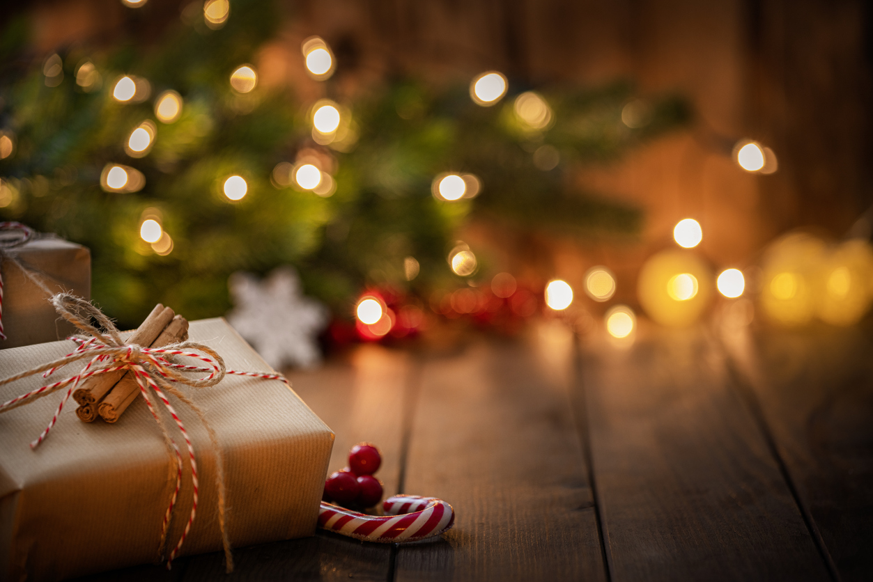 Brown Christmas gift box on rustic wooden table. High resolution 42Mp studio digital capture taken with Sony A7rII and Canon EF 70-200mm f