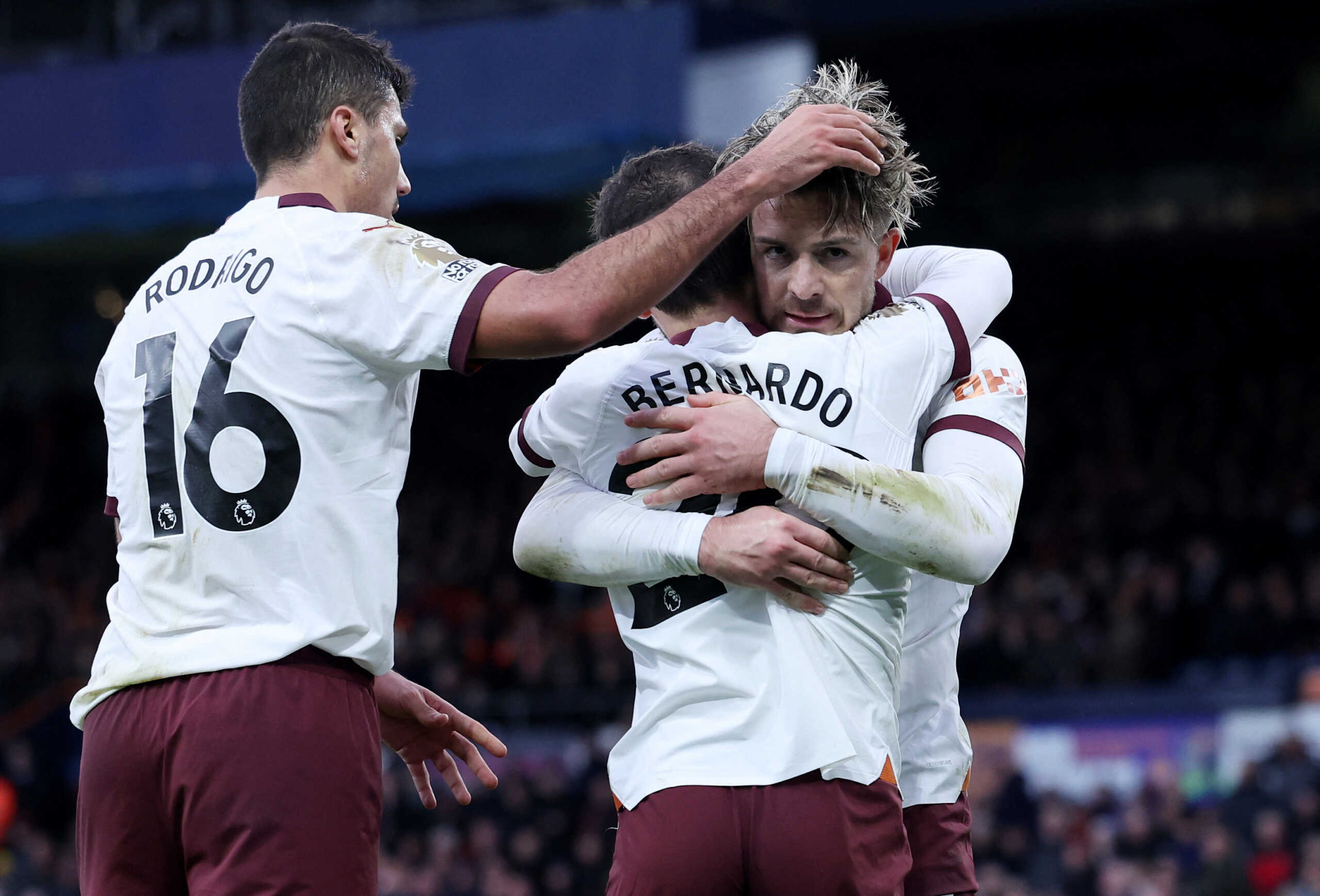 Soccer Football - Premier League - Luton Town v Manchester City - Kenilworth Road, Luton, Britain - December 10, 2023 Manchester City's Jack Grealish celebrates scoring their second goal with Bernardo Silva and Rodri REUTERS