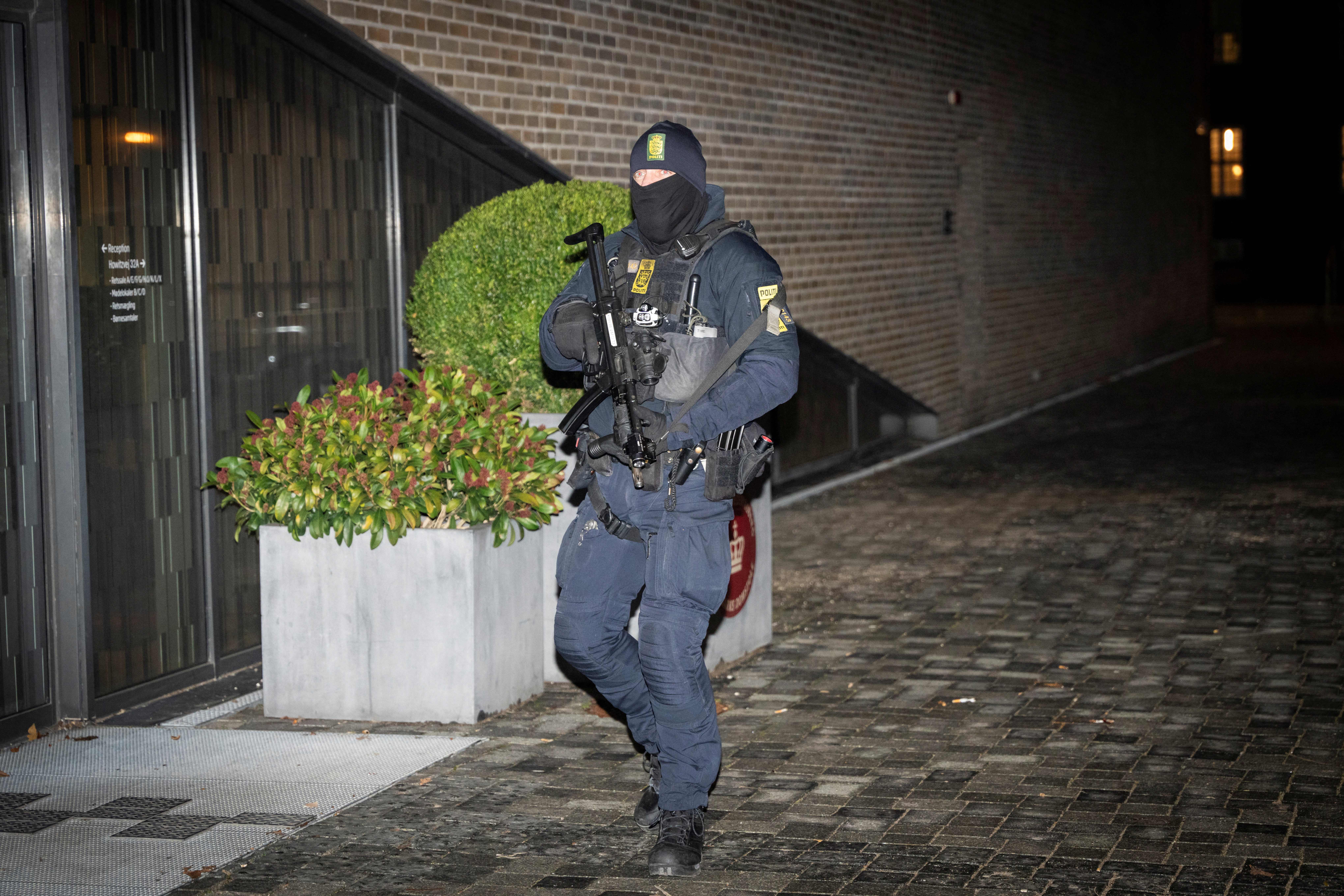 A police officer stands in front of the court in Frederiksberg, as Danish police made a large operation which resulted in three people being arrested in Denmark and, according to Danish media, will be charged for violating criminal law's provision on terrorism, Denmark December 14, 2023.  Ritzau Scanpix