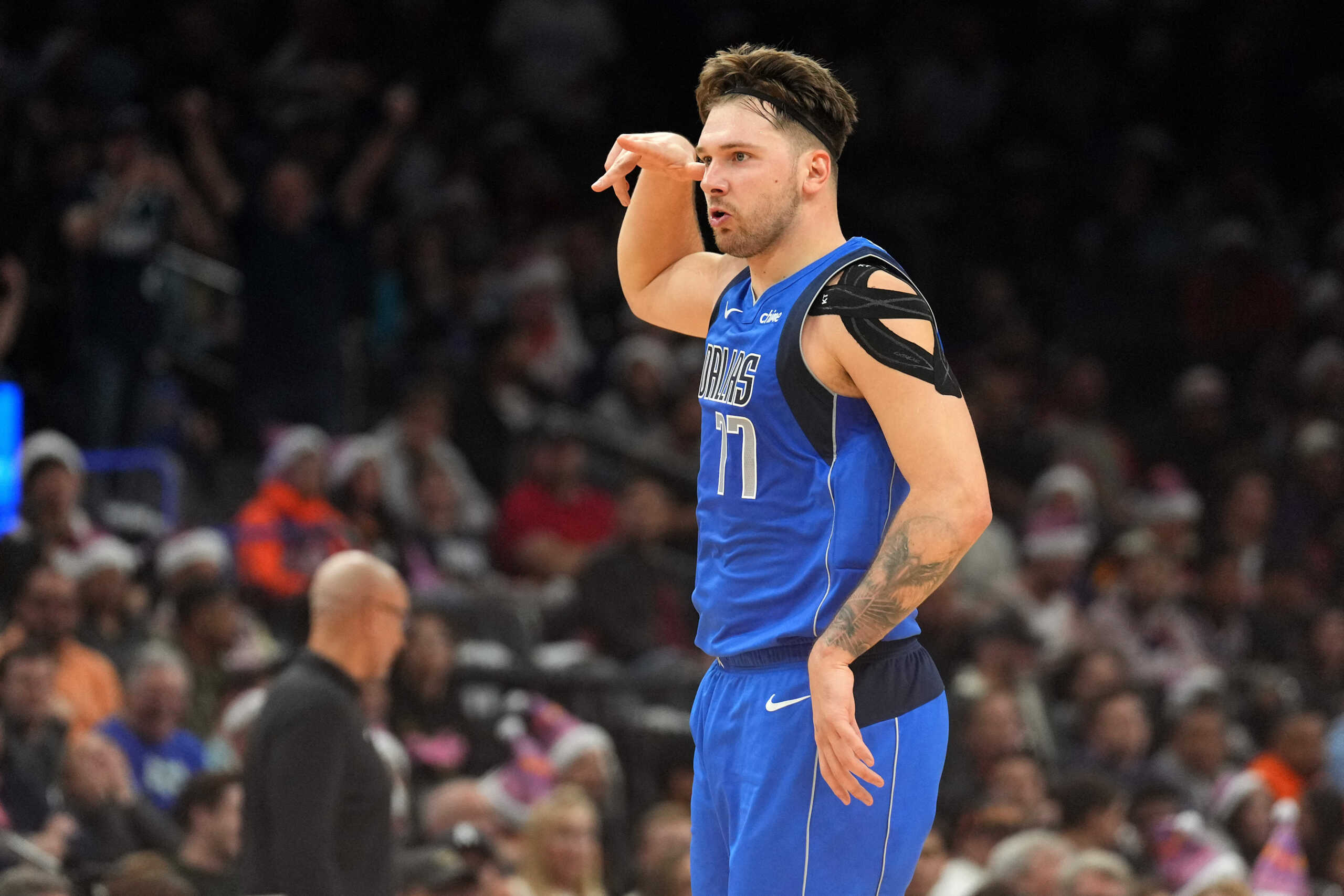 Dec 25, 2023; Phoenix, Arizona, USA; Dallas Mavericks guard Luka Doncic (77) celebrates a basket against the Phoenix Suns that put him over 10,000 points for his career during the first half at Footprint Center.  Mandatory Credit: Joe Camporeale-USA TODAY Sports