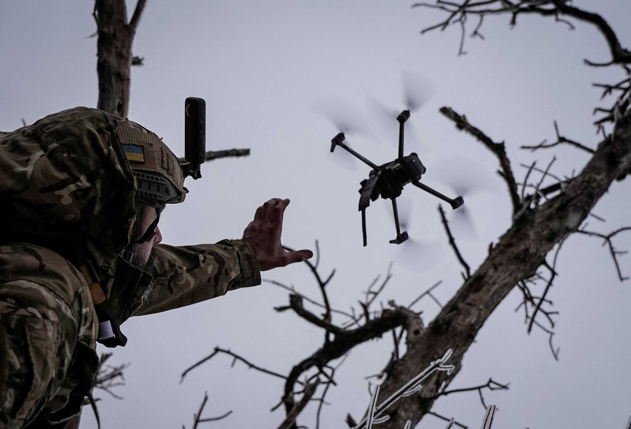 Ukrainian serviceman launches a kamikaze FPV drone at a front line, amid Russia's attack on Ukraine, near the city of Bakhmut in Donetsk region, Ukraine December 12, 2023. REUTERS