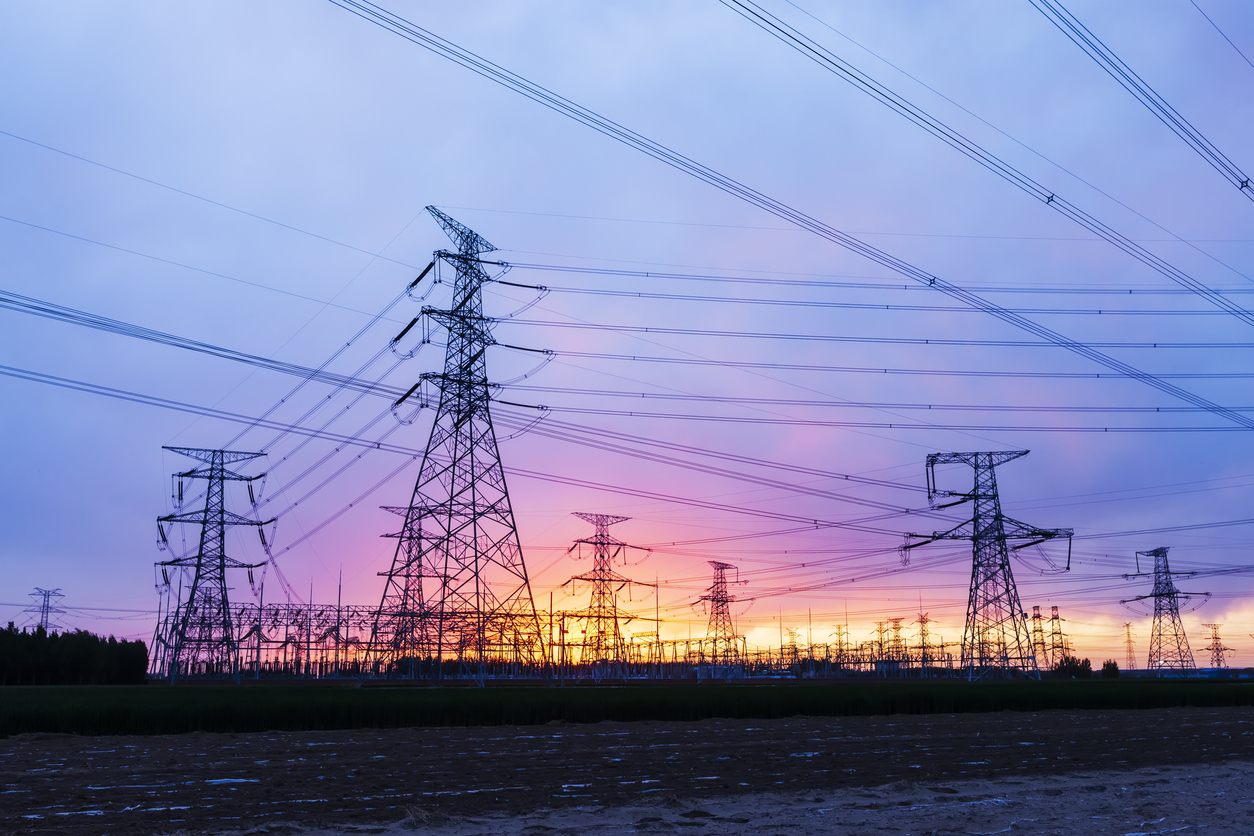 Pylons, high voltage pylons in the evening