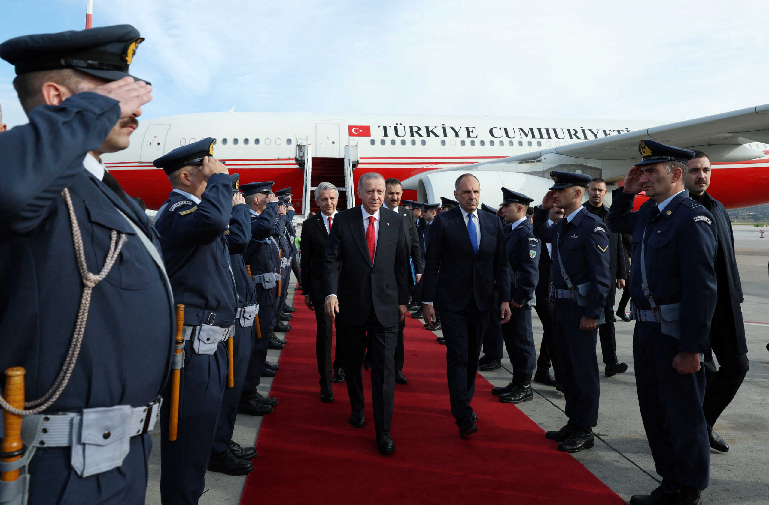 Turkish President Tayyip Erdogan is welcomed by Greek Foreign Minister George Gerapetritis upon his arrival at the Eleftherios Venizelos International Airport in Athens, Greece December 7, 2023. Turkish Presidential Press Office