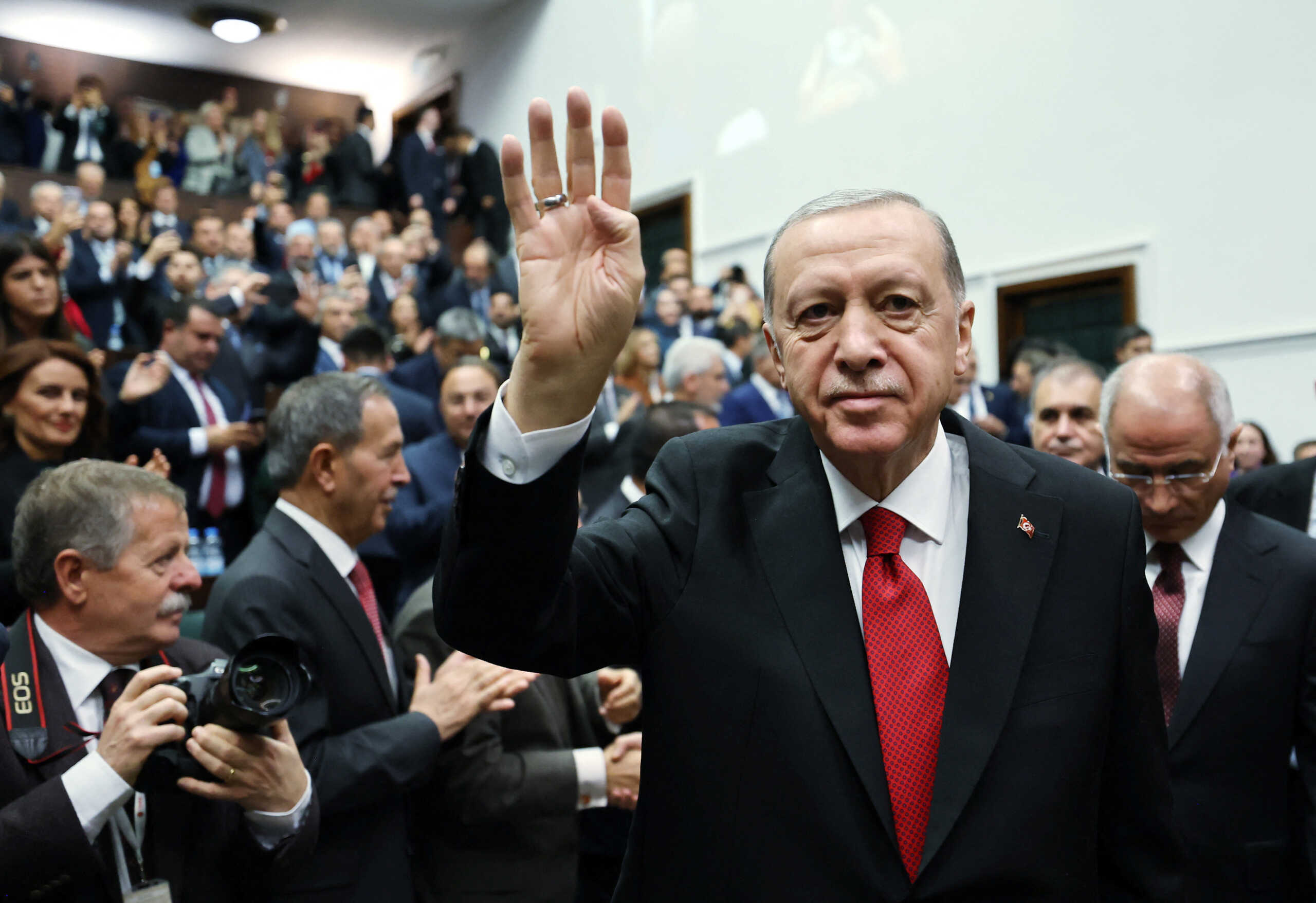 Turkey's President Tayyip Erdogan greets lawmakers of his ruling AK Party during a meeting at the Parliament in Ankara, Turkey November 29, 2023. Murat Cetinmuhurdar