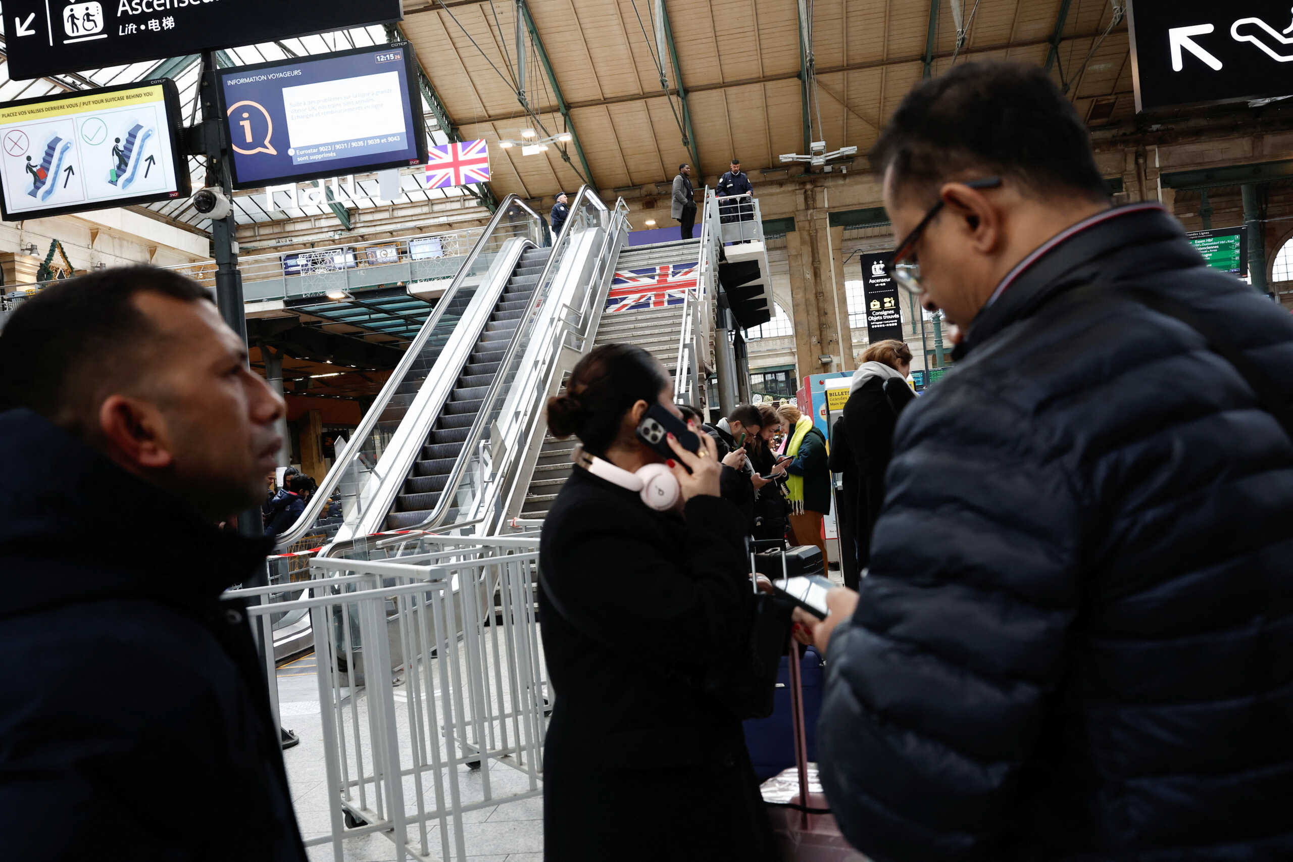 Passengers queue at the departure gates of the Eurostar terminal at Gare du Nord train station, as flooding in a railway tunnel near London forced the cancellation of more than a dozen trains linking Britain with the European mainland, in Paris, France, December 30, 2023. REUTERS