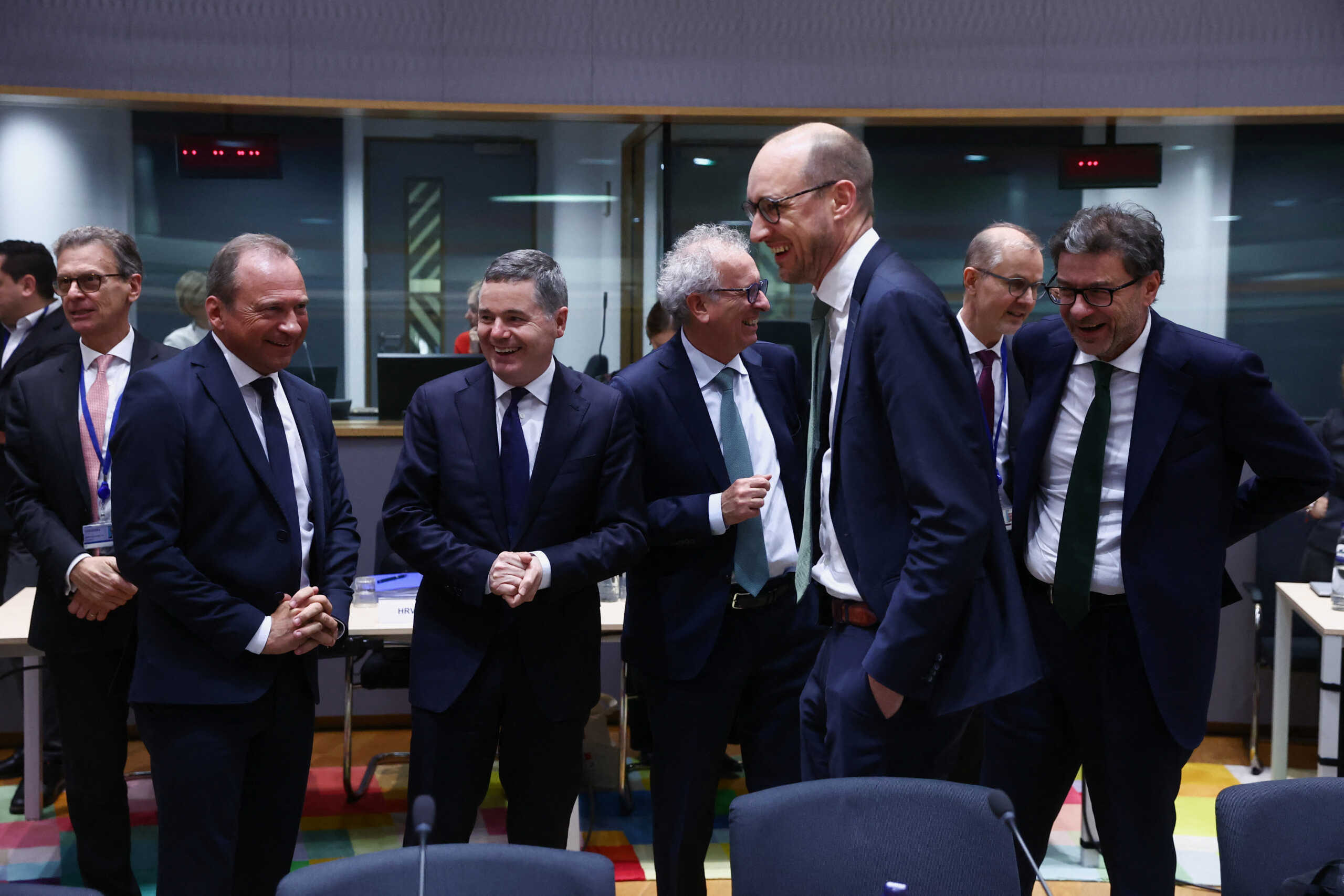 Luxembourg's Finance Minister Gilles Roth, Eurogroup President Paschal Donohoe, Belgium's Finance Minister Vincent Van Peteghem, Italy's Finance Minister Giancarlo Giorgetti talk on the day of the Eurozone finance ministers meeting in Brussels, Belgium December 7, 2023. REUTERS