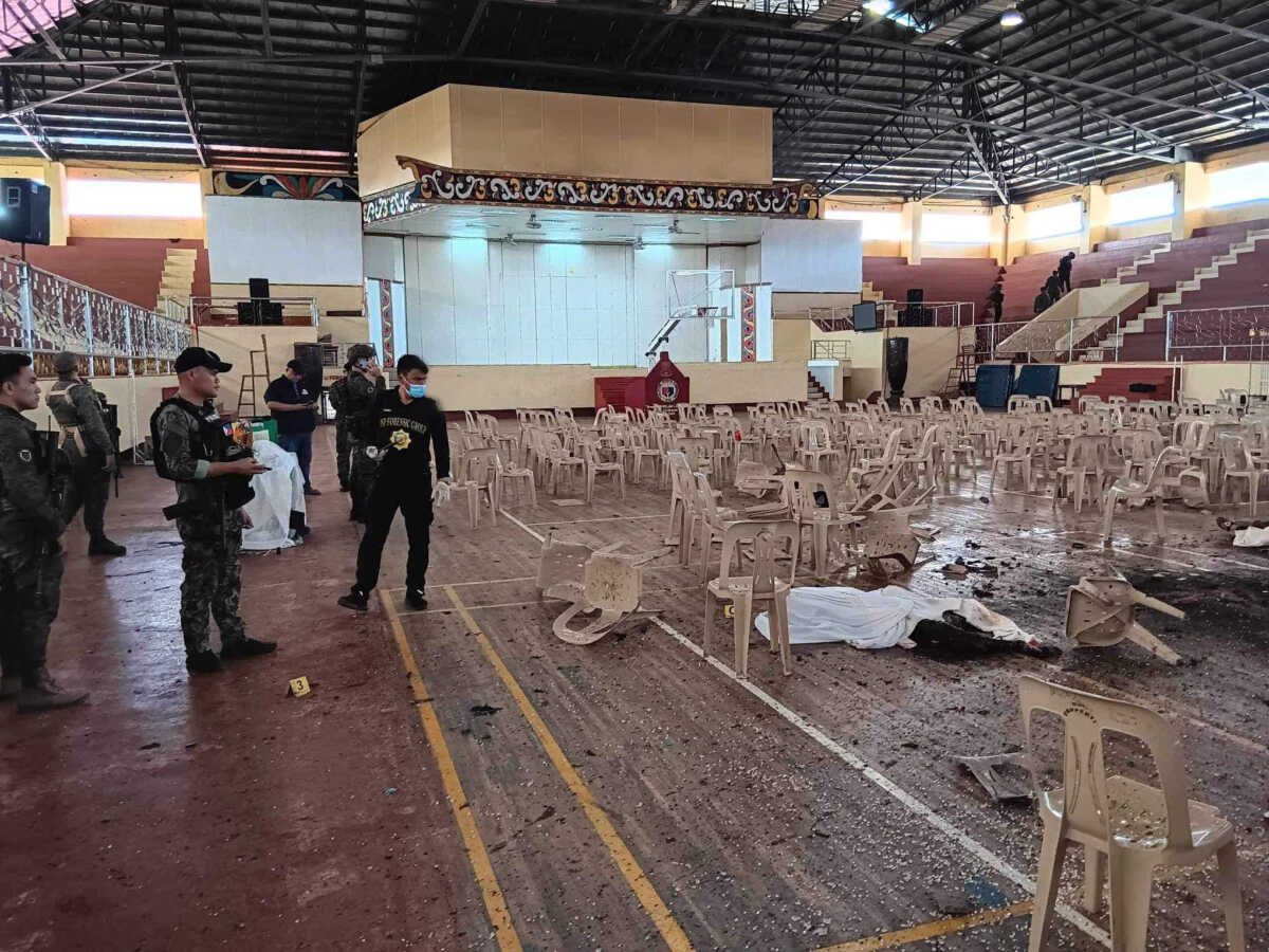 SENSITIVE MATERIAL. THIS IMAGE MAY OFFEND OR DISTURB    Law enforcement officers investigate the scene of an explosion that occurred during a Catholic Mass in a gymnasium at Mindanao State University in Marawi, Philippines, December 3, 2023. Lanao Del Sur Provincial Government