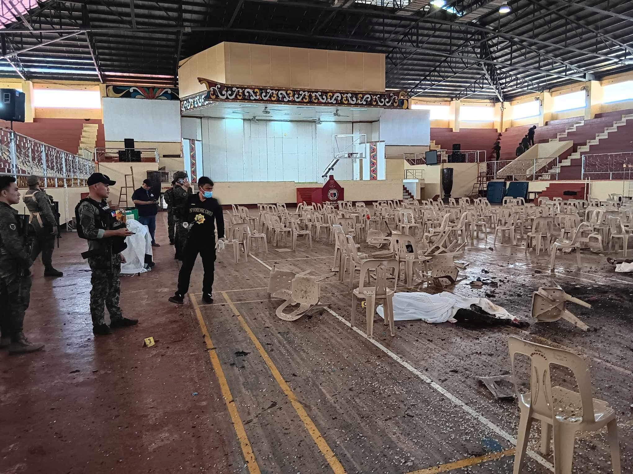 SENSITIVE MATERIAL. THIS IMAGE MAY OFFEND OR DISTURB    Law enforcement officers investigate the scene of an explosion that occurred during a Catholic Mass in a gymnasium at Mindanao State University in Marawi, Philippines, December 3, 2023. Lanao Del Sur Provincial Government