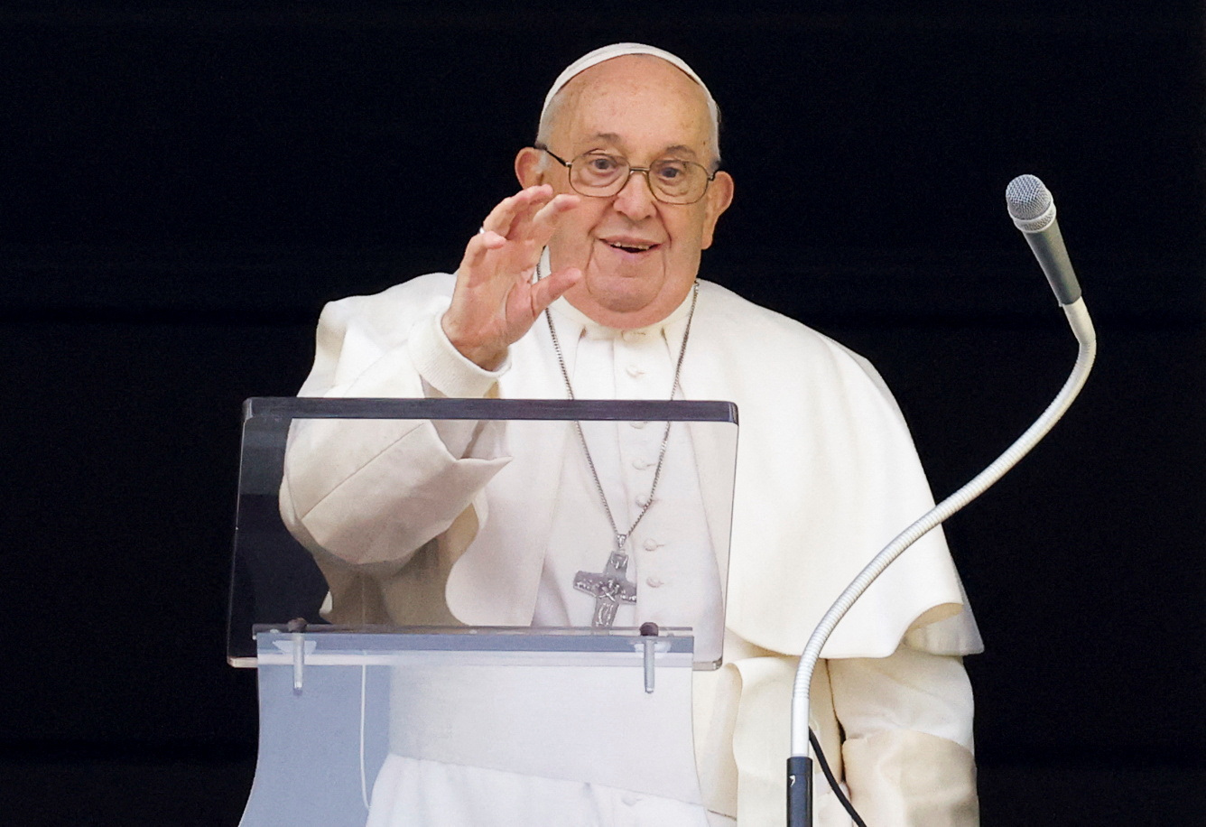 Pope Francis arrives to lead the Angelus prayer from his window, in St. Peter's Square at the Vatican, December 24, 2023. REUTERS