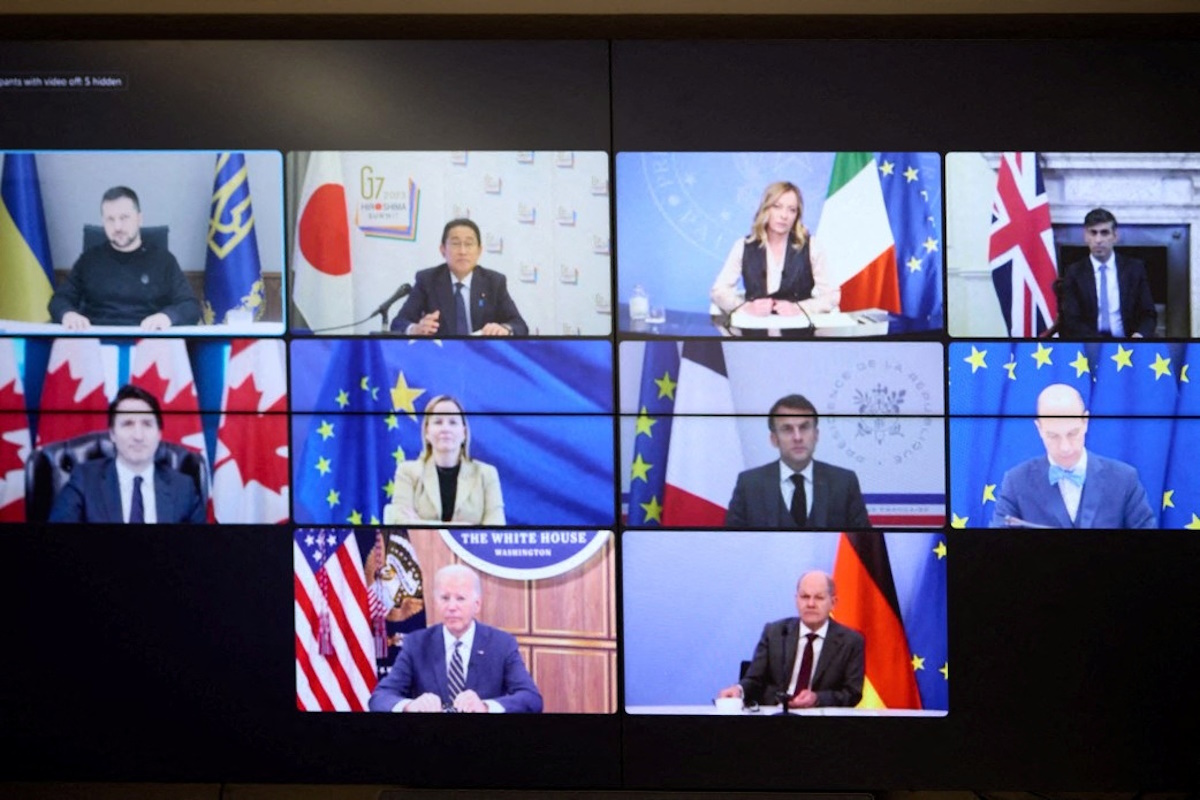 G7 summit leaders appear on a monitor during a video conference with Ukraine's President Volodymyr Zelenskiy, amid Russia's attack on Ukraine, in Kyiv, Ukraine December 6, 2023. Ukrainian Presidential Press Service