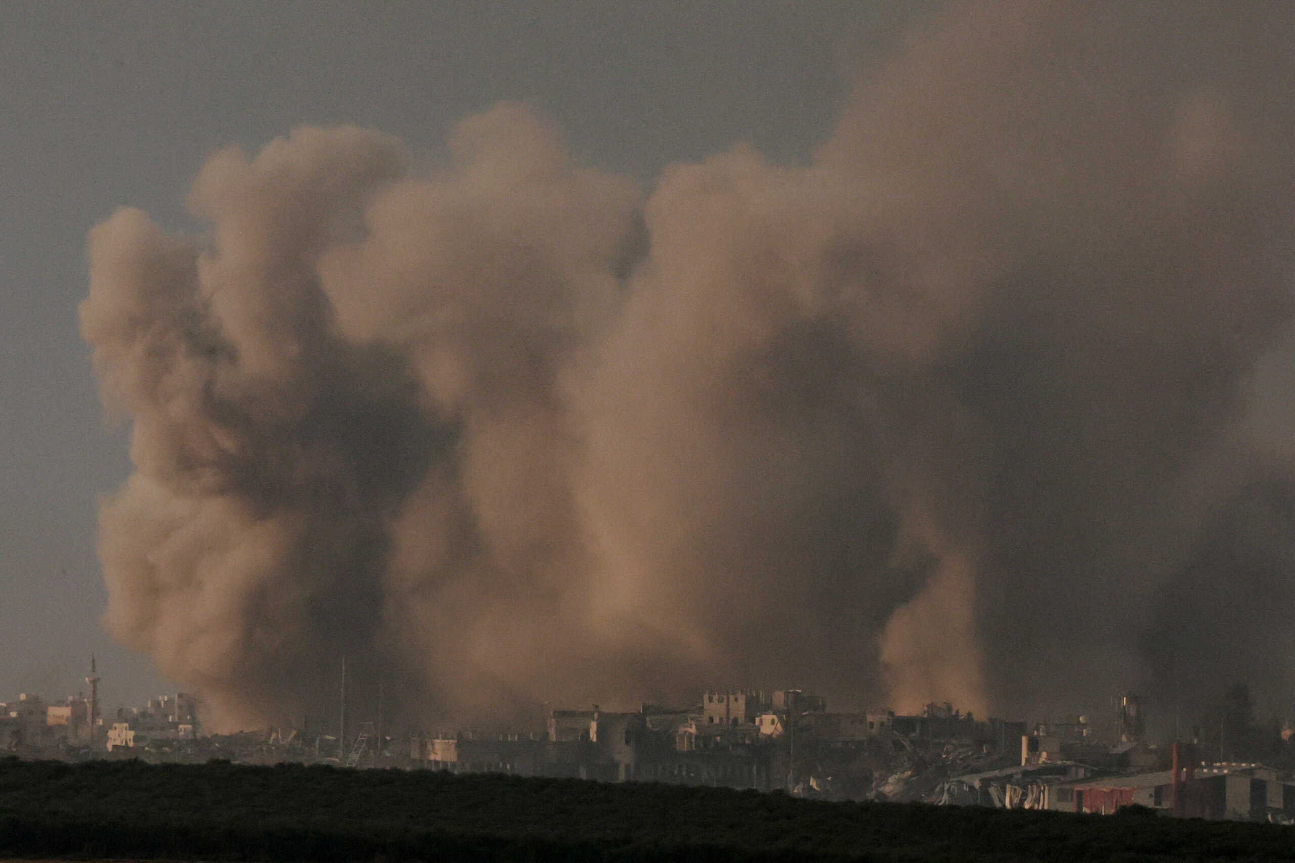 Smoke rises over Gaza, amid the ongoing conflict between Israel and the Palestinian Islamist group Hamas, as seen from southern Israel, December 12, 2023. REUTERS
