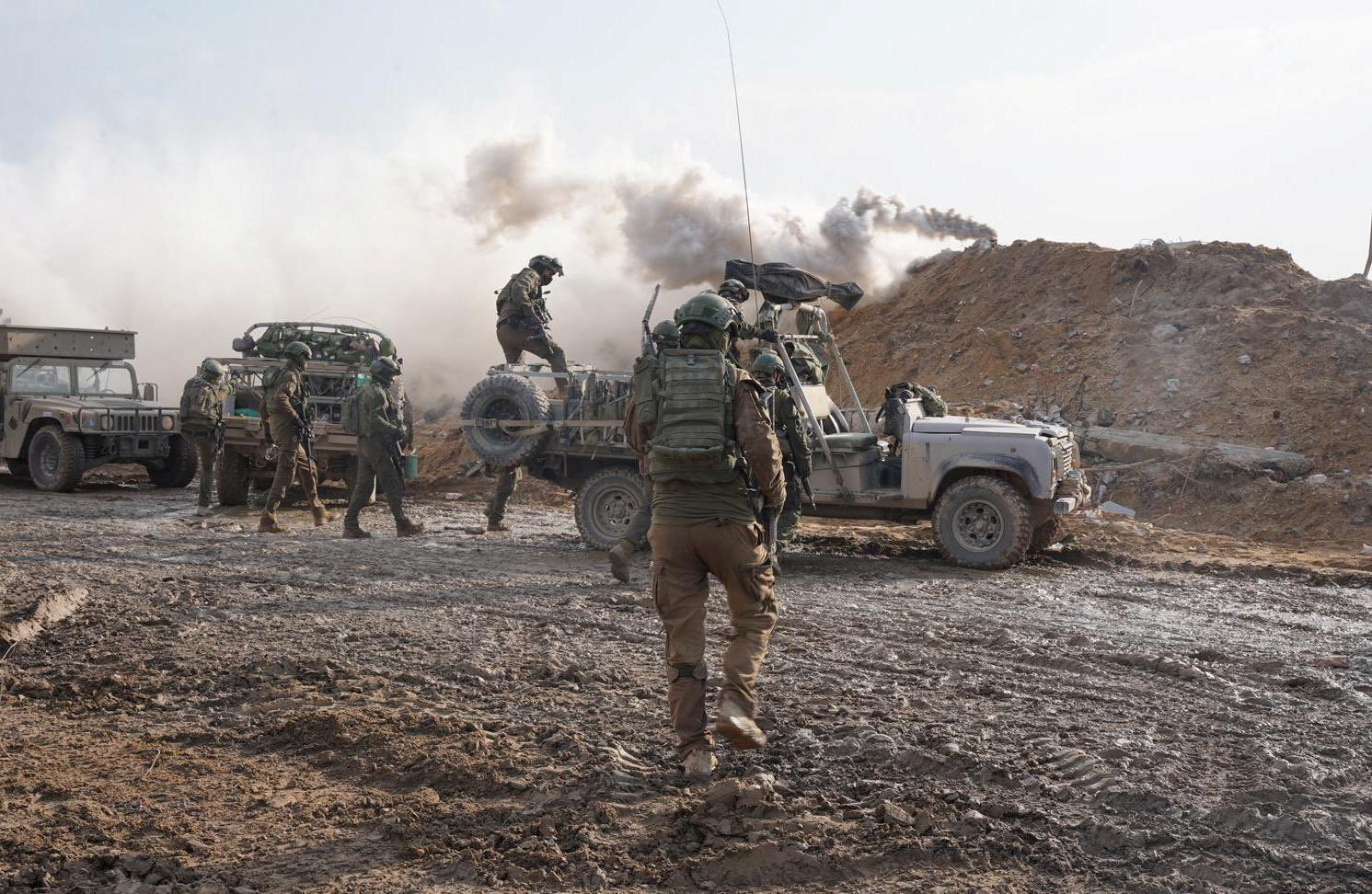 Israeli soldiers operate in the Gaza Strip amid the ongoing conflict between Israel and the Palestinian Islamist group Hamas, in this handout picture released on December 14, 2023. Israel Defense Forces