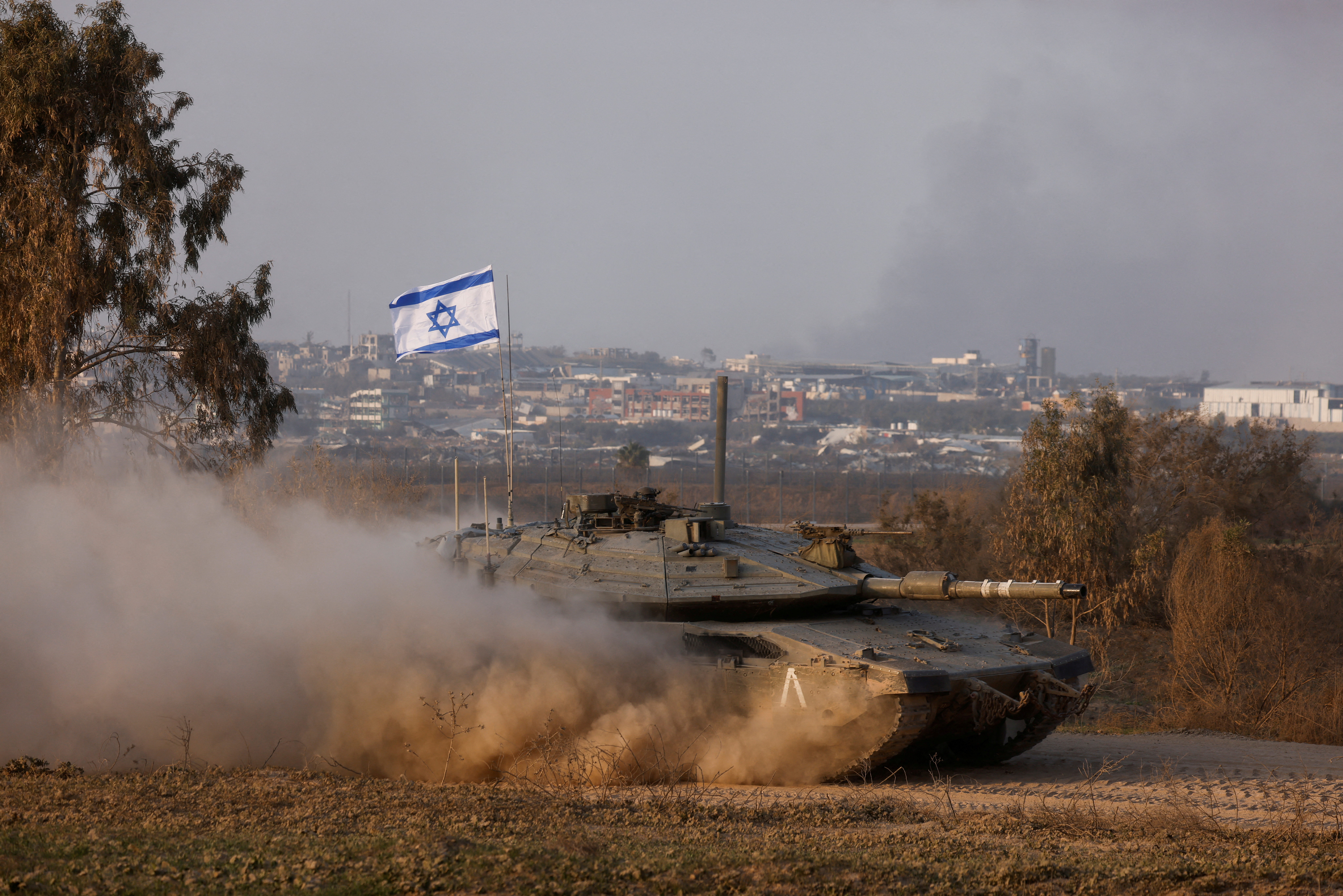 An Israeli tank operates, amid the ongoing conflict between Israel and the Palestinian Islamist group Hamas, near the Israel-Gaza border, in Israel, December 30, 2023. REUTERS