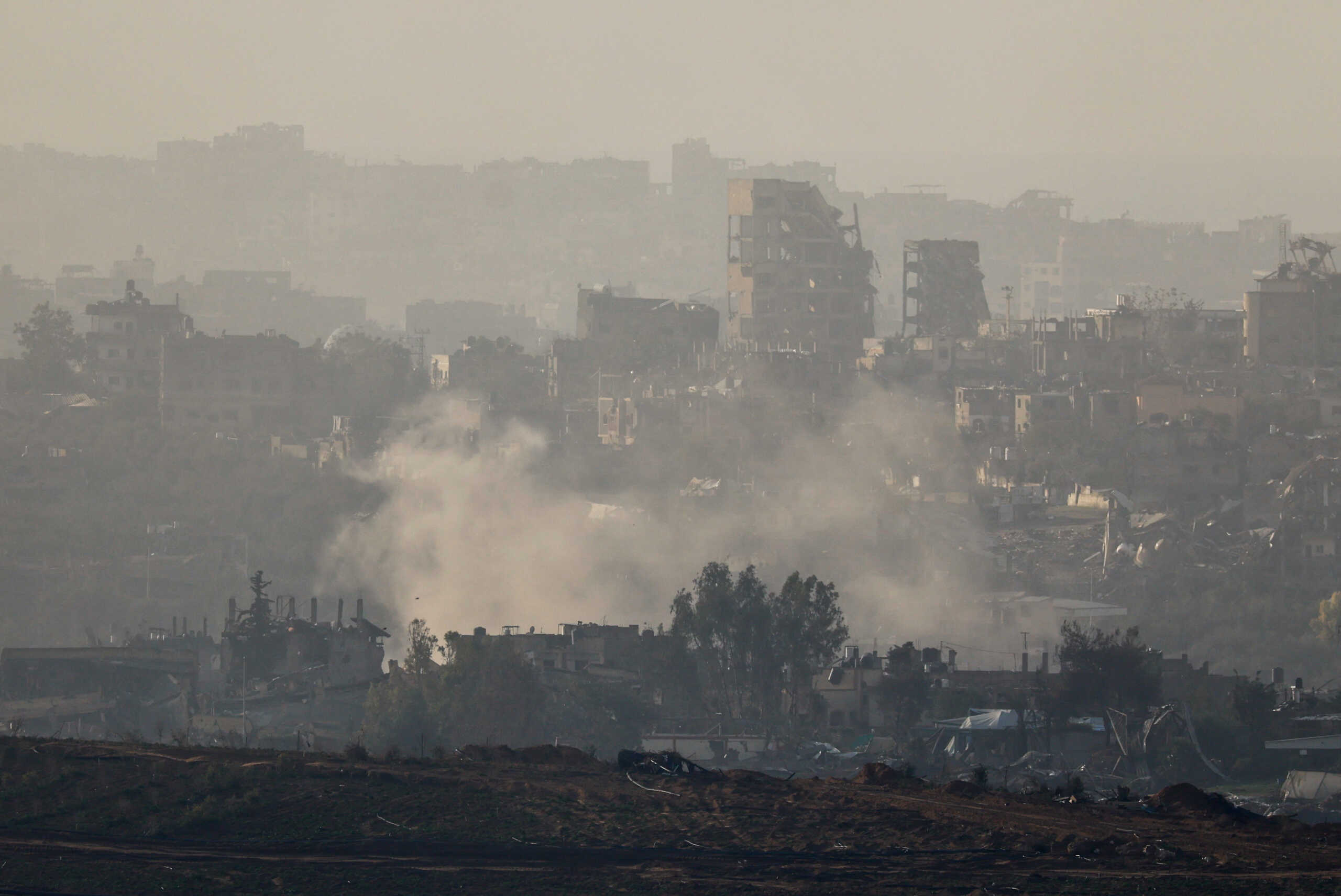 Smoke rises over Gaza, amid the ongoing conflict between Israel and the Palestinian Islamist group Hamas, as seen from southern Israel, December 13, 2023. REUTERS
