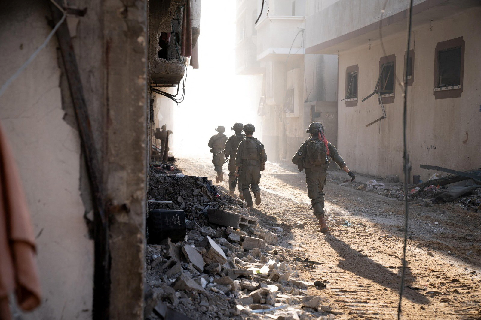 Israeli soldiers operate in the Gaza Strip amid the ongoing conflict between Israel and the Palestinian Islamist group Hamas, in this handout picture released on December 28, 2023.   Israel Defense Forces