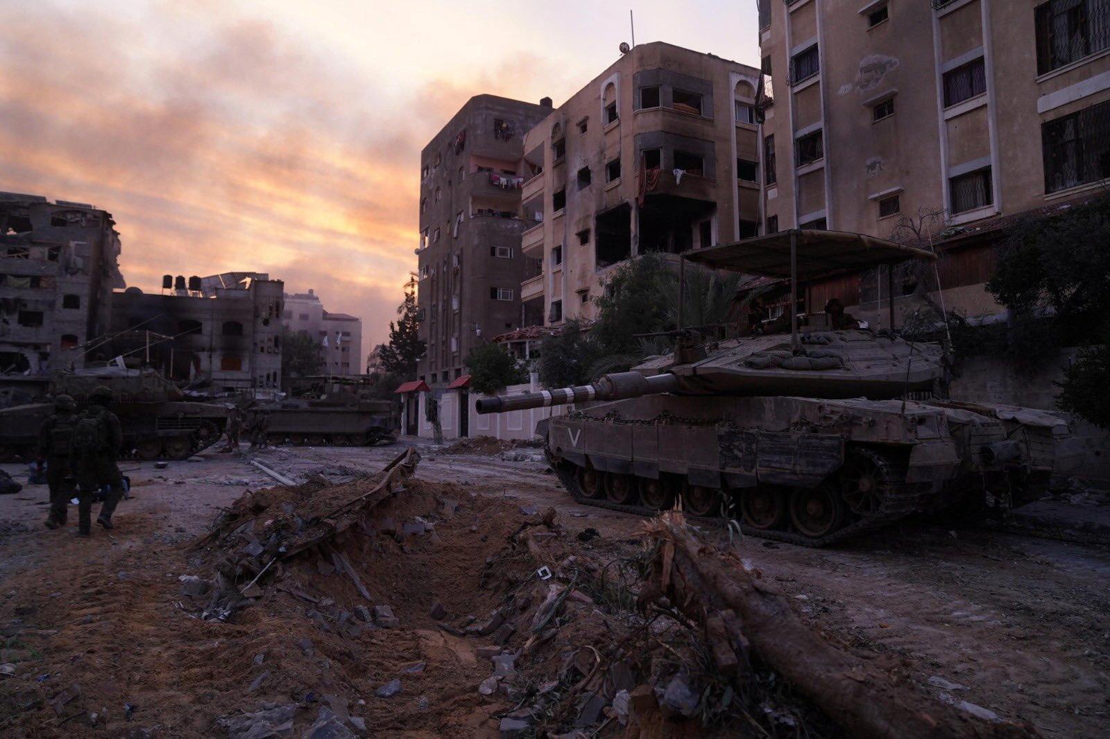 An Israeli soldier looks on from Merkava tank during operations in the Gaza Strip amid the ongoing conflict between Israel and the Palestinian Islamist group Hamas, in this handout picture released on December 17, 2023. Israel Defense Forces
